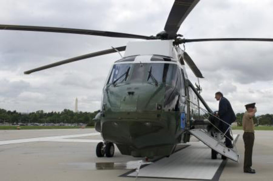 Secretary of Defense Leon E. Panetta boards a U.S. Marine Corps VH-3D Sea King helicopter assigned to Marine Helicopter Squadron (HMX) 1 at the Pentagon Aug. 10, 2012. Panetta traveled aboard the helicopter to the National Museum of the Marine Corps in Triangle, Va., to speak at a Marine Corps Officer Candidates School commissioning ceremony. 
