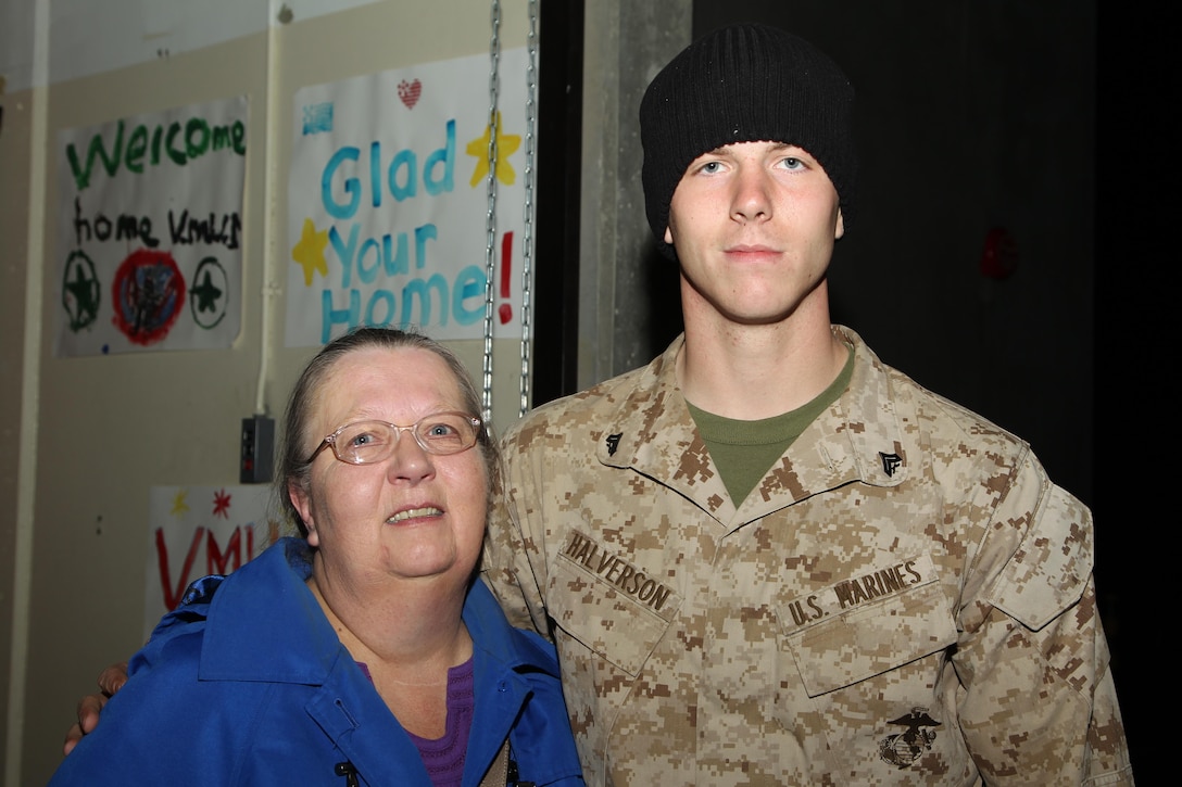 Cpl. Robert Halverson, data network specialist, Unmanned Aerial Vehicle Squadron 1, is reunited with his grandmother, Linda Clarin, during the squadron's homecoming at the VMU-1 hangar Nov. 22, 2013.