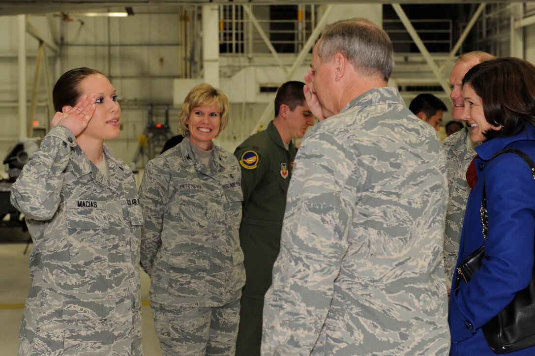 Senior Airman Kristina Macias, 28th Medical Operations Squadron public health technician, salutes Air Force Chief of Staff Gen. Mark A. Welsh III, after being recognized as a superior performer at Ellsworth Air Force Base, S.D., Nov. 26, 2013. Welsh met with Airmen to thank them for their service and discuss current Air Force challenges and opportunities. (U.S. Air Force photo by Senior Airman Zachary Hada/Released)