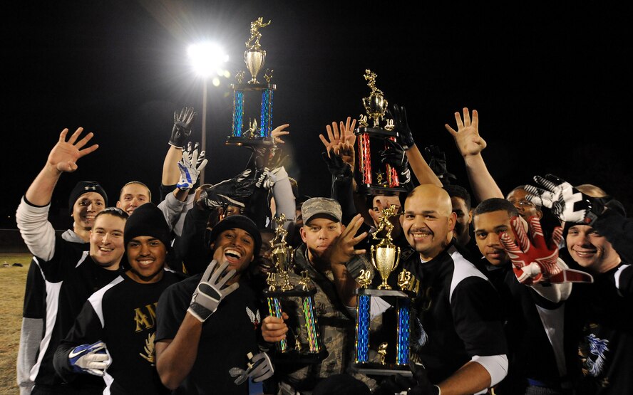 Members of the 509th Aircraft Maintenance Squadron Dragons intramural football team hold up “four” signs in celebration of their fourth consecutive flag football championship at Whiteman Air Force Base, Mo., Nov. 15, 2013. The Dragons won a close game against the 509th Force Support Squadron FSS in the fourth quarter 28-26. (U.S. Air Force photo by Staff Sgt. Nick Wilson/Released)
