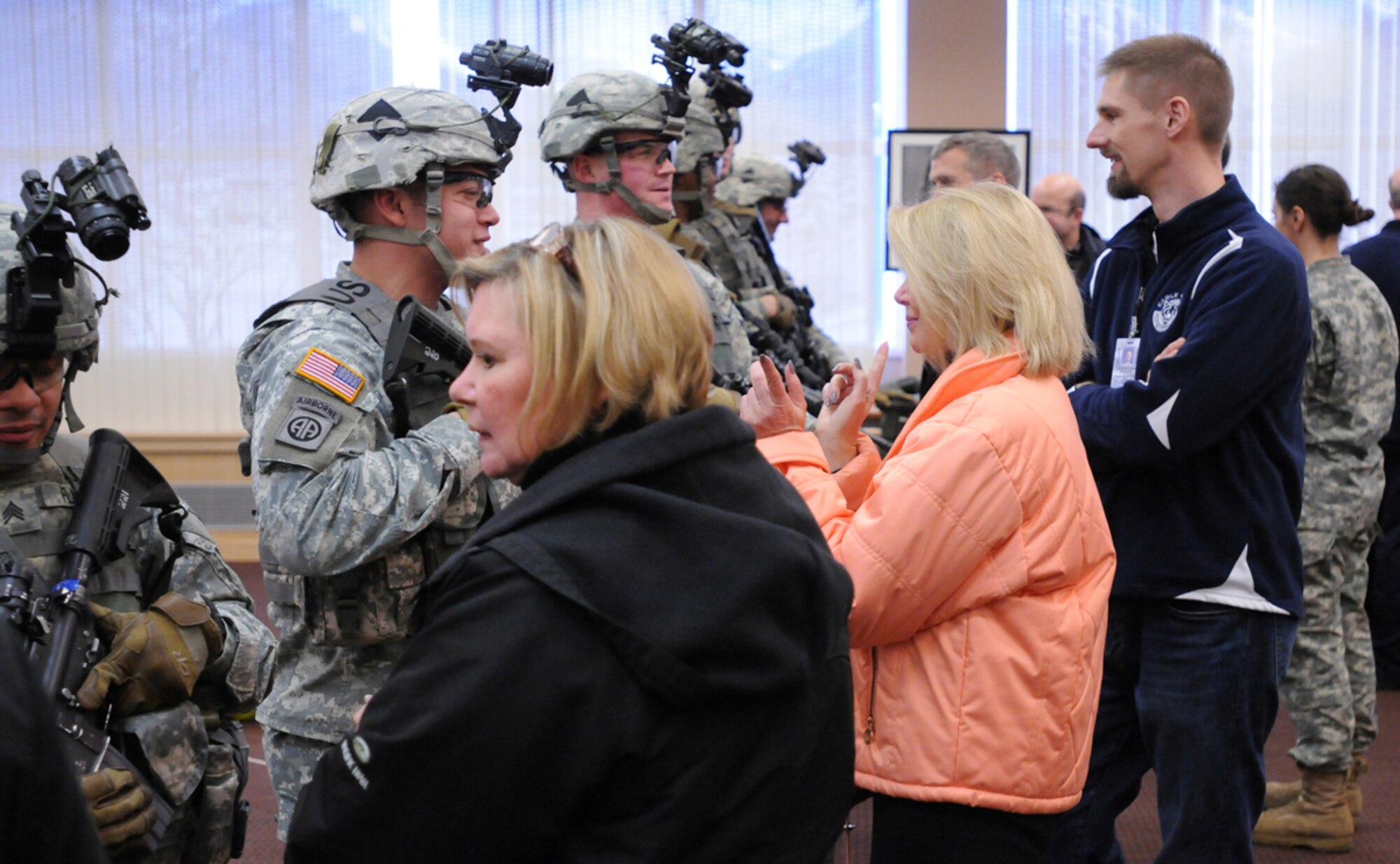 Alaska community leaders and paratroopers with the 4th Infantry Brigade Combat Team (Airborne), 25th Infantry division, get a chance to interact with each other during “The Paratrooper Experience” community partnership day Nov. 13, at Joint Base Elmendorf-Richardson. The Paratroopers displayed tactical arctic equipment and shared knowledge and techniques for operating in an extreme cold weather environment. (U.S. Army photo/Staff Sgt. Jeffrey Smith)