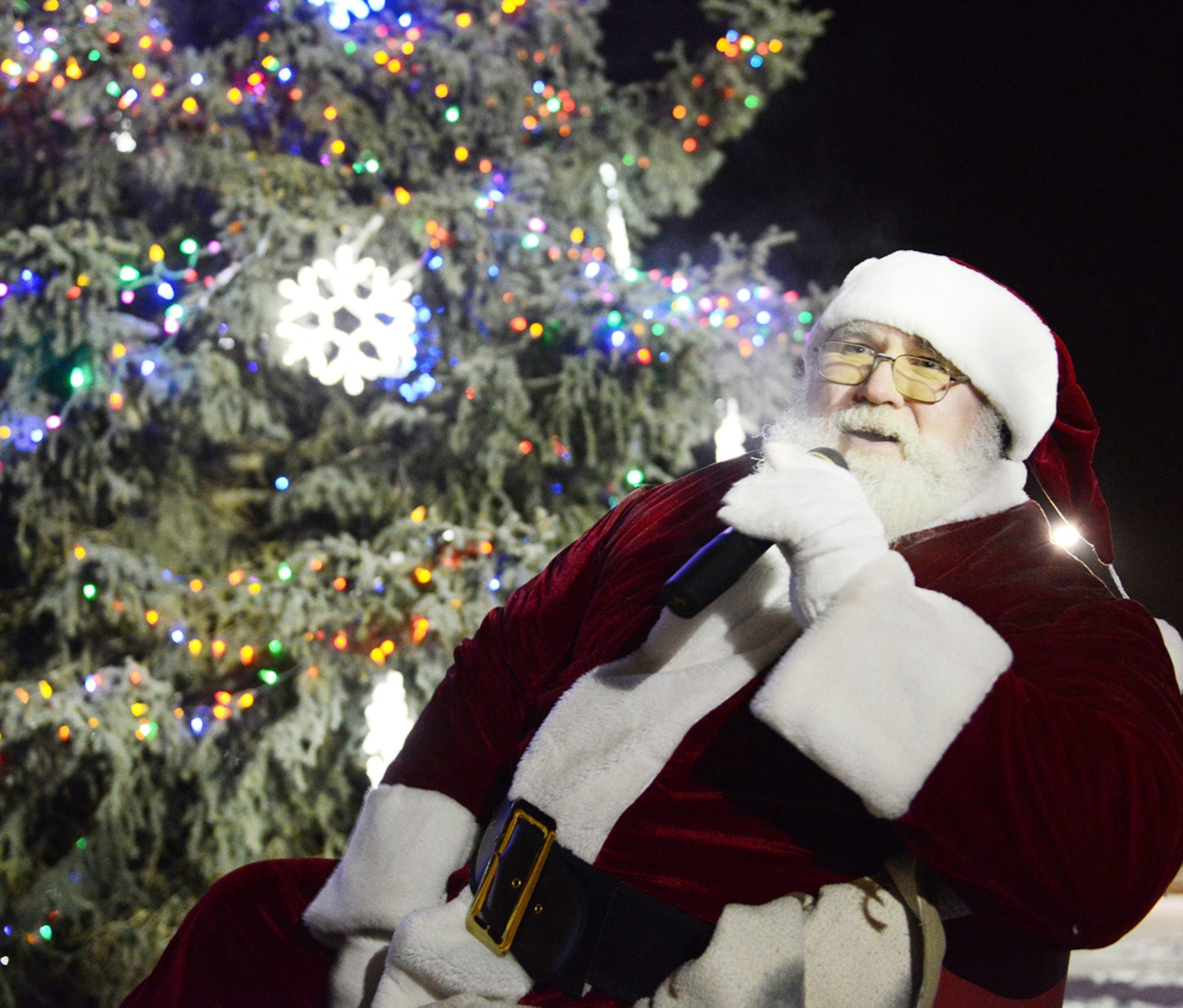 Santa speaks to the crowd after the tree lighting on Joint Base Elmendorf-Richardson Dec. 4, 2012. Children got to see and talk to Santa and see real reindeer as part of the event which included a holiday concert and a tree lighting. (U.S. Air Force photo/Staff Sgt. Zachary Wolf)