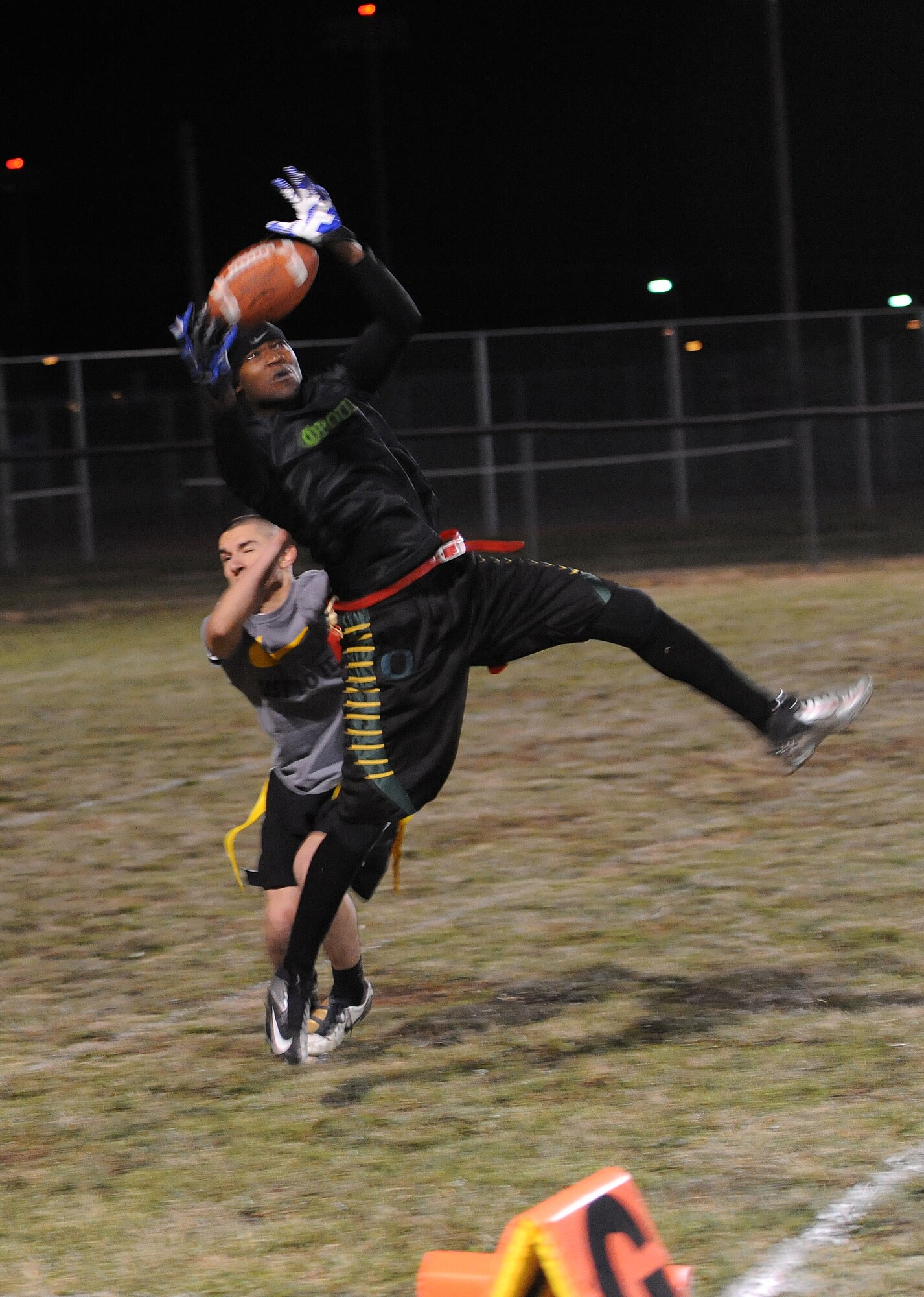 Antonio Chatman, 509th Security Forces Squadron wide receiver, makes the game-winning catch during an intramural flag football playoff game against the Medical Group at Whiteman Air Force Base, Mo., Nov. 14, 2013. After defeating the MDG, the SFS moved up to the final round of the playoffs. (U.S. Air Force photo by Staff Sgt. Nick Wilson/Released)