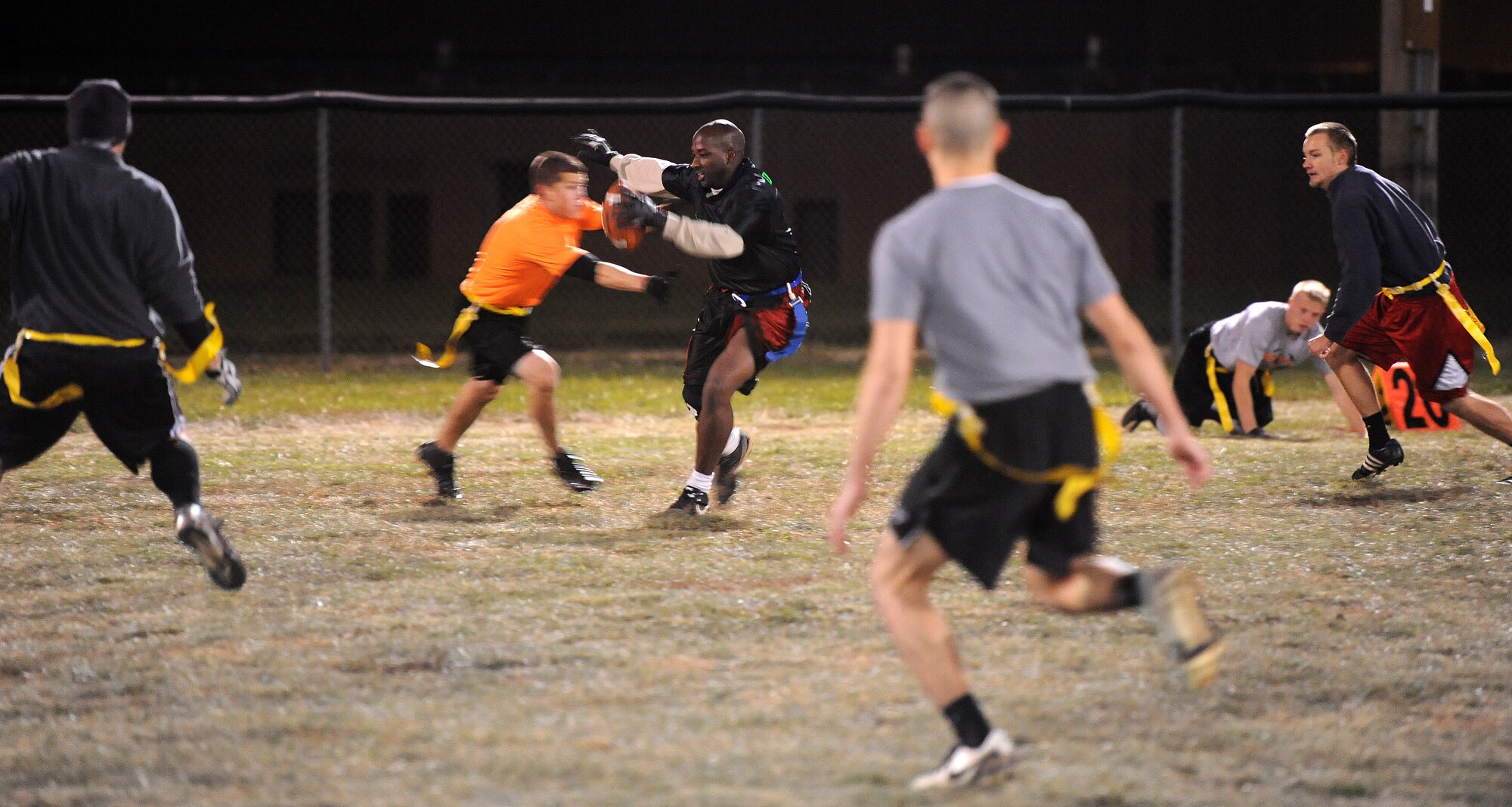 Darryl Allen, 509th Aircraft Maintenance Squadron Dragon flag football team wide receiver, runs for positive yardage during an intramural flag football playoff game against the Medical Group at Whiteman Air Force Base, Mo., Nov. 14, 2013. The SFS defeated the MDG in the fourth quarter with a score of 14-12. (U.S. Air Force photo by Staff Sgt. Nick Wilson/Released)