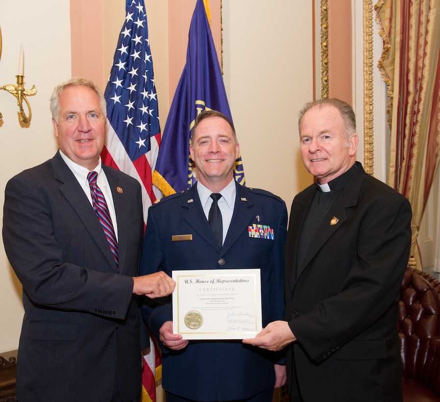 Illinois Congressman John Shimkus and the 60th Chaplain of the United States House of Representatives, Reverend Patrick J. Conroy, S.J., presented the 932nd Airlift Wing Chaplain (Maj.) Howard Bell a certificate of appreciation during his visit to Washington on July 18th. (Photo submitted)