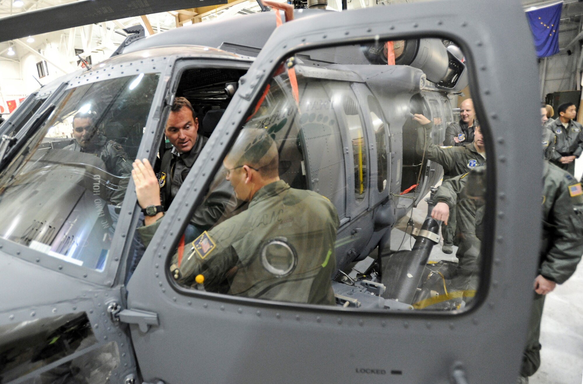 Acting Secretary of the Air Force Eric Fanning talks with Airmen assigned to the 176th Wing's Rescue Squadrons from a seat in one of their HH-60 Pave Hawk helicopters on Joint Base Elmendorf-Richardson, Alaska, Nov. 27, 2013. The 176th Wing's rescue squadrons' core competency is combat search and rescue which enable them to provide search and rescue operations and support military forces in the Alaska Theater. (U.S. Air Force photo/Justin Connaher)