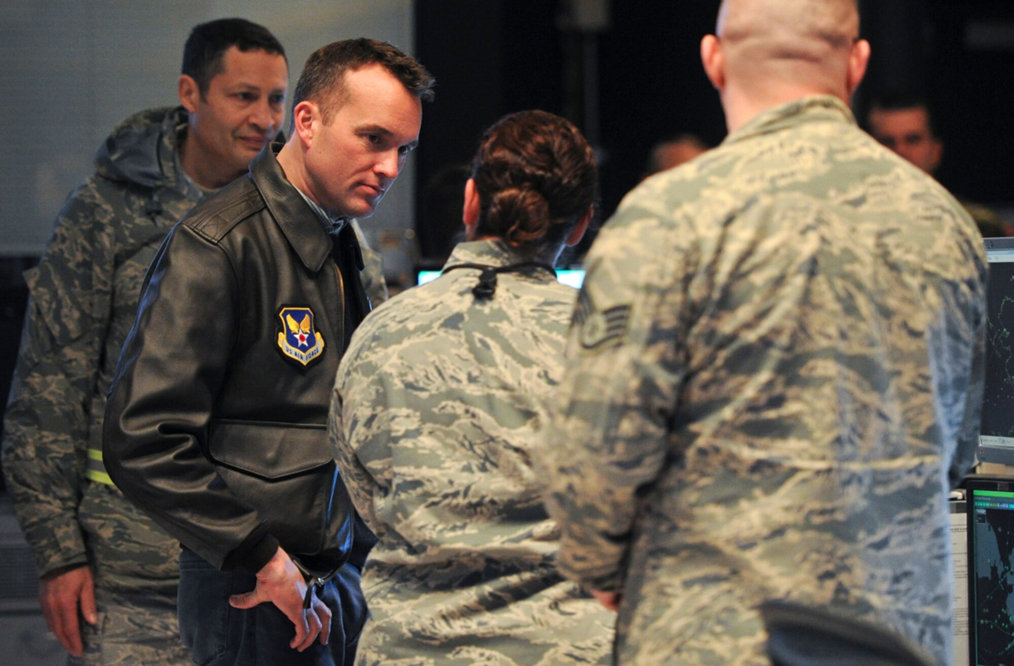 Acting Secretary of the Air Force Eric Fanning listens to Airmen assigned to the 176th Air Defense Squadron talk about their vital role in America's defense on Joint Base Elmendorf-Richardson, Alaska, Nov. 27, 2013. The 176th ADS provides 24/7 command and control, battle management, surveillance, data link, identification, and intercept control for the Alaska NORAD Region. (U.S. Air Force photo/Justin Connaher)