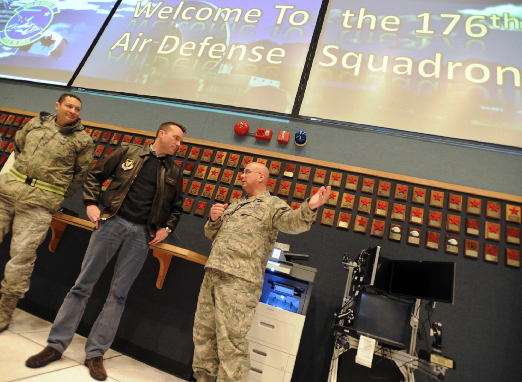 Acting Secretary of the Air Force Eric Fanning listens to Airmen assigned to the 176th Air Defense Squadron talk about their vital role in America's defense on Joint Base Elmendorf-Richardson, Alaska, Nov. 27, 2013. The 176th ADS provides 24/7 command and control, battle management, surveillance, data link, identification, and intercept control for the Alaska NORAD Region. (U.S. Air Force photo/Justin Connaher)