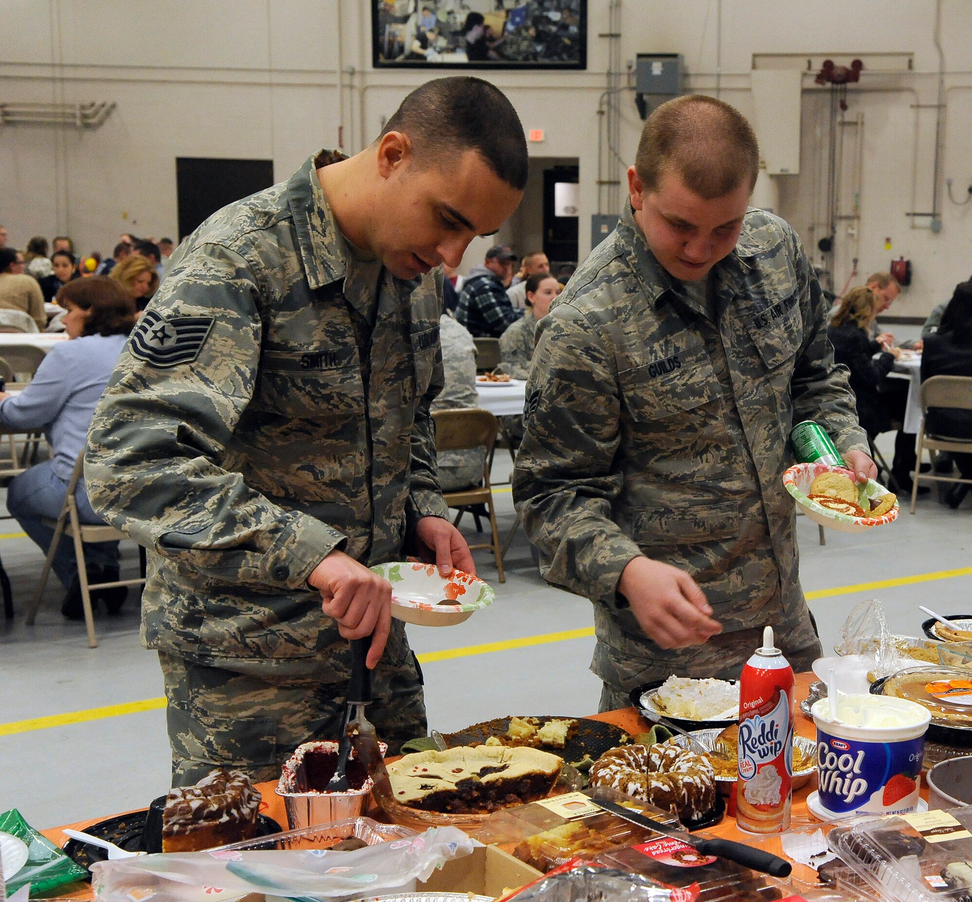 Team Malmstrom members enjoy a buffet of food during the 341st Maintenance Group’s annual Turkey Feed on Nov. 22. In all, more than 100 pounds of turkey were served to hungry guests during the event. (U.S. Air Force photo/Airman 1st Class Collin Schmidt)
