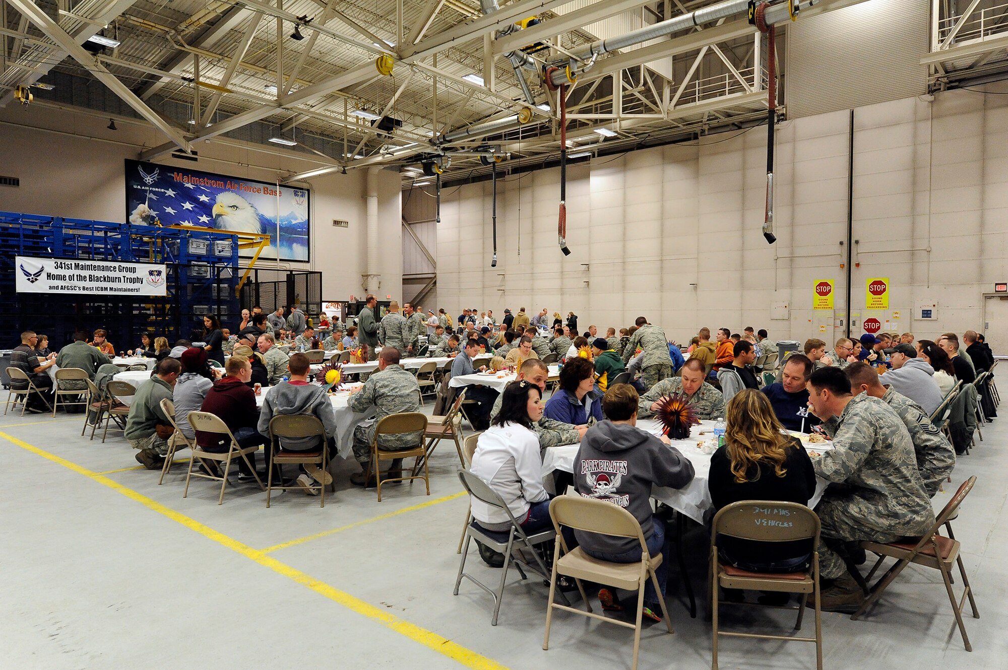 Team Malmstrom members enjoy each other’s company during the 341st Maintenance Group’s annual Turkey Feed Nov. 22 at the 3-Bay hangar. More than 100 Airmen, along with their friends and family, attended the event. (U.S. Air Force photo/Airman 1st Class Collin Schmidt)