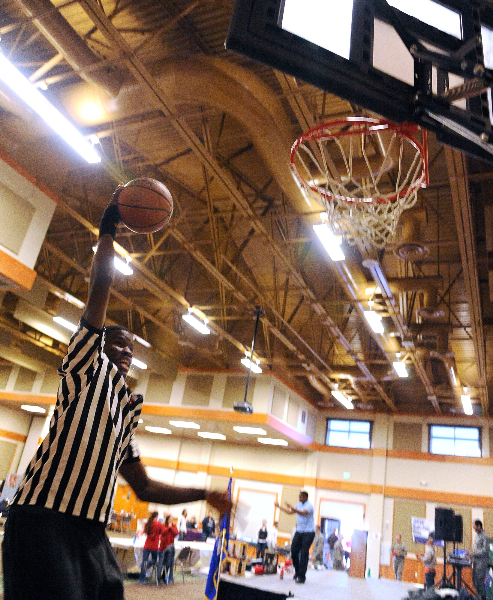 Airman 1st Class Joshua Omijie, 341st Civil Engineer Squadron heating ventilation and air conditioning technician, dunks during a basketball game at the Grizzly Bend during the Wing Sports Smackdown on Nov 22. The Airman’s Council and Company Grade Officers’ Association teamed up host the last Wing Sports Smackdown of the year. (U.S. Air Force photo/Airman 1st Class Collin Schmidt)