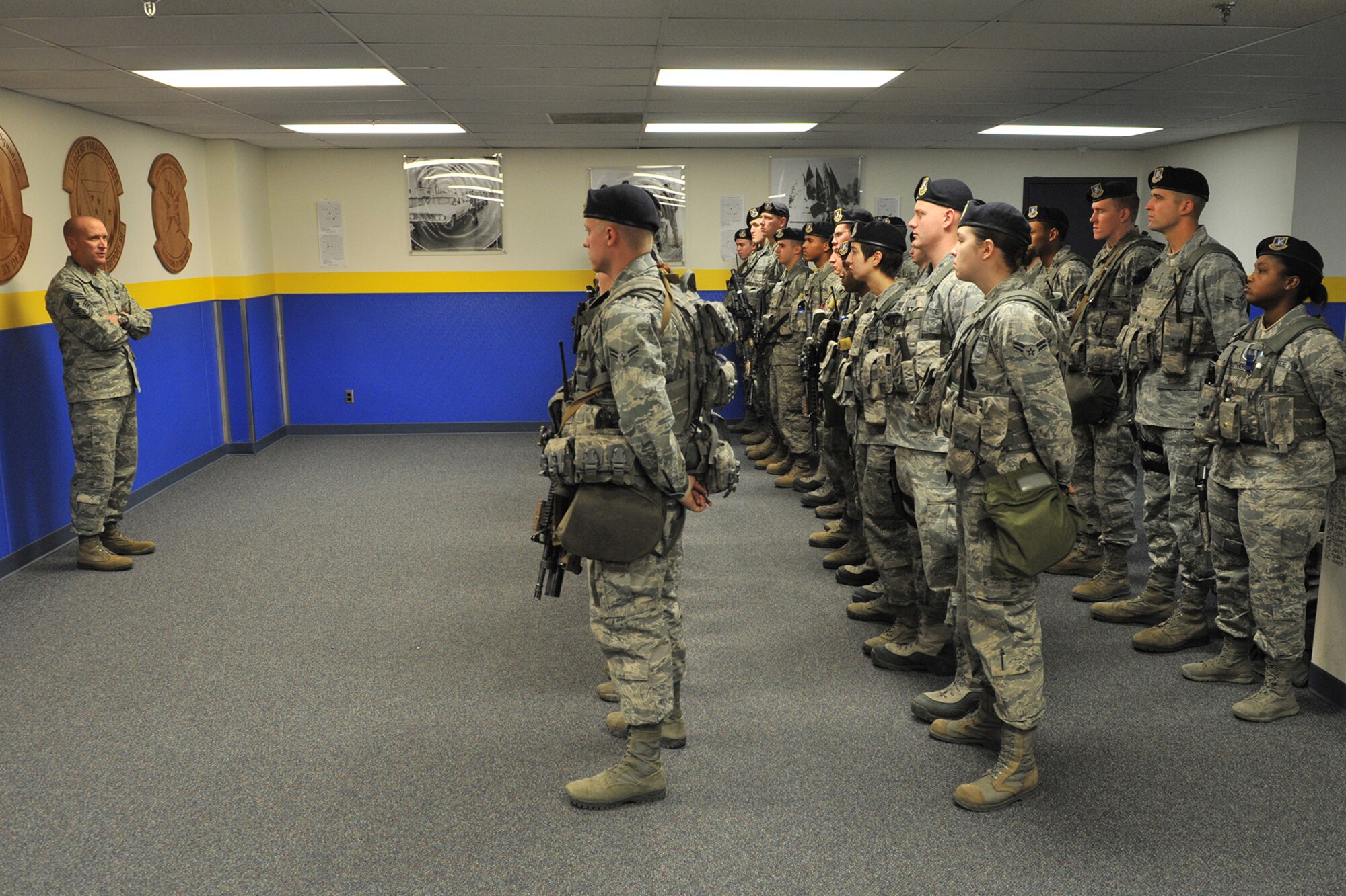 Chief Master Sgt. Brian Hornback, Air Force Global Strike Command chief, briefs members of a guard mount at Bldg. 500 on Nov. 21. Hornback’s two-day visit was scheduled to be his final visit before his retirement set for February. (U.S. Air Force photo/John Turner)