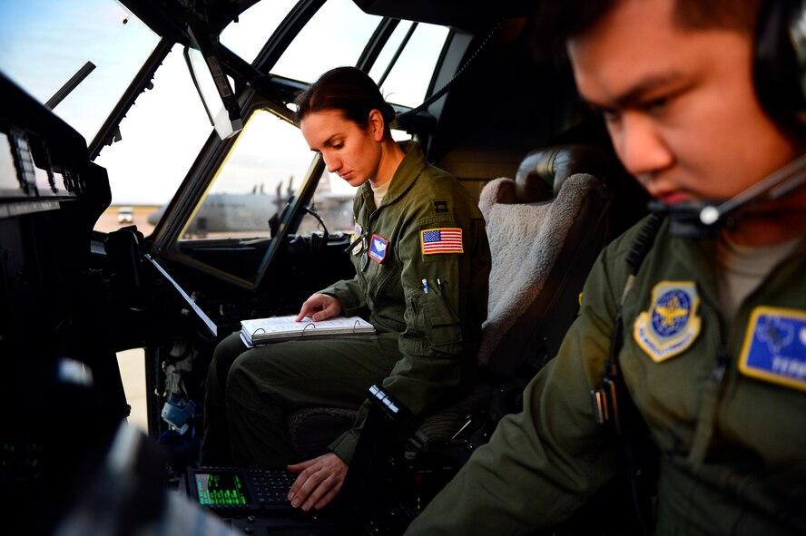 U.S. Air Force Captain Terry Wu, 40th Airlift Squadron, and Captain Heather Lendrum, 39th Airlift Squadron, C-130J Super Hercules pilots, perform preflight checks Nov. 21, 2013, during Impact Day at Dyess Air Force Base, Texas. Impact Day was designed to give maintainers and aircrew personnel a chance to see what each other do on a daily basis . Preflight checks are performed to ensure every system on the aircraft is operating correctly and safely prior to flight. (U.S. Air Force photo by Staff Sgt. Vernon Young Jr./Released)