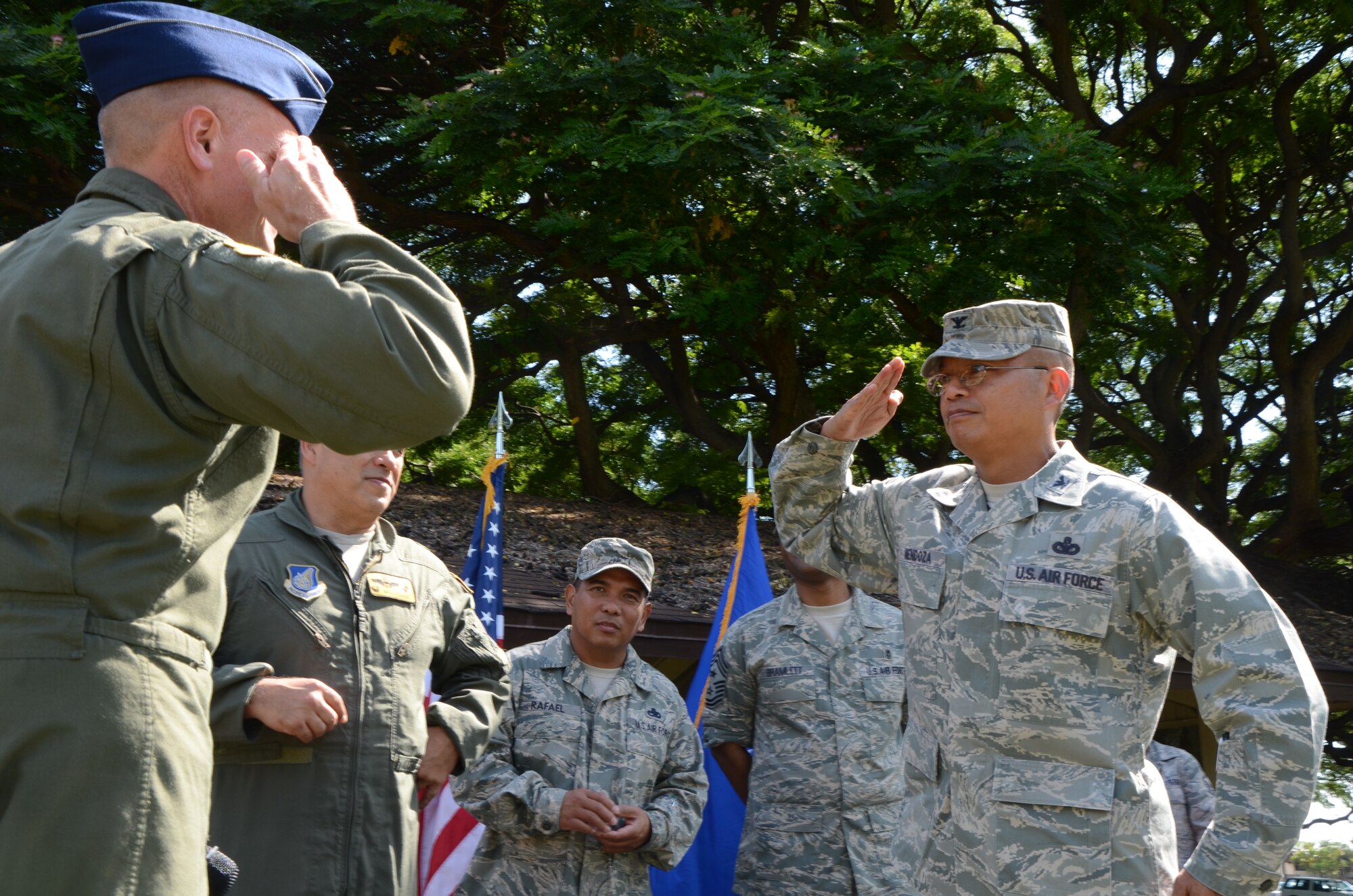 Col. Maynard "Max" Mendoza, right, commander of the 624th Regional Support Group renders a salute to Col. John J. Roscoe, left, commander of the 15th Wing, who called him front and center to be coined in recognition for the 624th RSG's overall outstanding leadership, support and participation in the Pacific Air Forces Inspector General Operational Readiness Inspection held here, Joint Base Pearl Harbor-Hickam, Hawaii, Nov. 19, 2013. The PACAF IG ORI was held from Oct. 28 to Nov. 4. (U.S. Air Force photo by Tech. Sgt. Phyllis E. Keith)