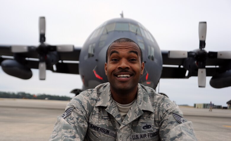 Staff Sgt. William Anderson, 901st Special Operations Aircraft Maintenance Squadron propulsion craftsman, sits in front of a C-130 on the flight line at Hurlburt Field, Fla., Nov. 21, 2013. Anderson recently returned from a special duty as NCO in charge of the Eglin Air Force Base honor guard. (U.S. Air Force photo/Staff Sgt. Victoria Sneed)