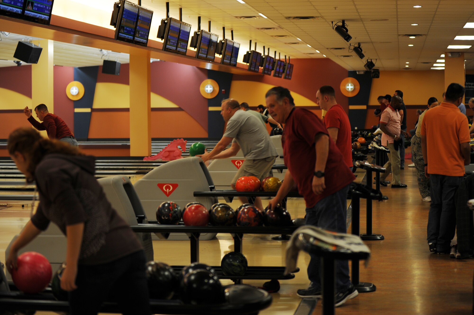 League bowlers compete at the Langley Lanes bowling center at Langley Air Force Base, Va., Nov. 20, 2013. The Joint Base Langley-Eustis bowling centers offer patrons the chance to participate in open or league play at an affordable price, said Dave Meador, 633rd Force Support Squadron bowling center manager. (U.S. Air Force photo by Staff Sgt. Jarad A. Denton/Released)