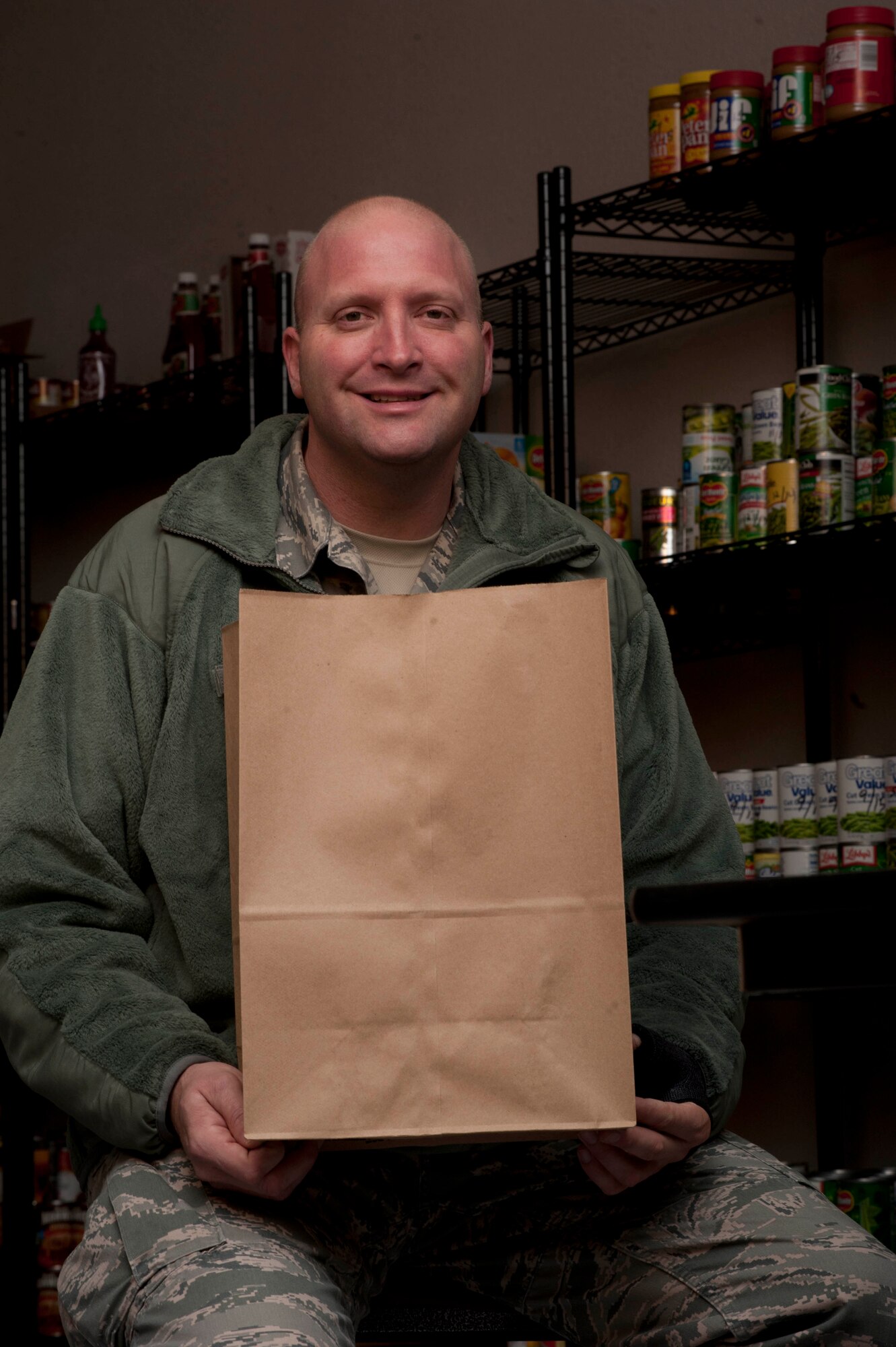 A food drive took place at the Airmen and Family Readiness Center here, so families could have the opportunity to enjoy a tasty holiday cheer. Airman 1st Class James Thompson, a 365th Training Squadron student studying to be a communications navigation specialist, coordinated efforts while he was in a hospital bed recuperating from surgery. (U.S. Air force photo by Airman 1st Class Jelani Gibson) 