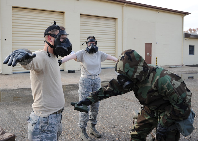 An emergency Management Support Team member utilizes a Joint Chemical Agent Detector during an Ability to Survive and Operate scenario on Barksdale Air Force Base, La., Nov. 21, 2013. The JCAD was used to verify the absence of chemical contaminates during the ATSO. (U.S. Air Force photo/Senior Airman Joseph A. Pagán Jr.)