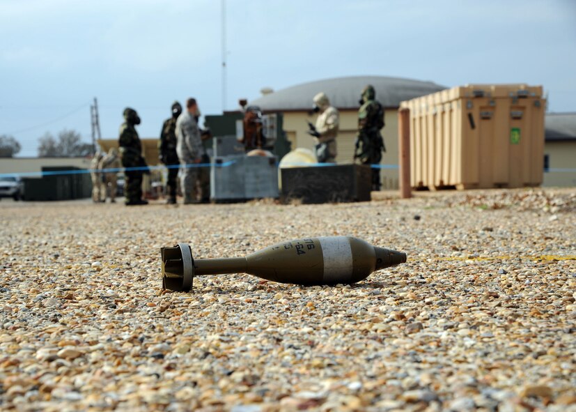 A simulated unexploded ordnance rests on the ground during an exercise on Barksdale Air Force Base, La., Nov. 21, 2013. The UXO was used during an Ability to Survive and Operate scenario to help train Airmen who are involved with a Post Attack Reconnaissance team on how to properly cordon and identify the UXO. (U.S. Air Force photo/Senior Airman Joseph A. Pagán Jr.)