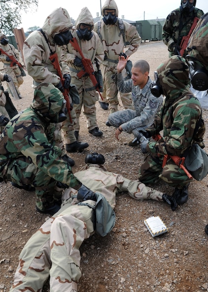 Tech. Sgt. Shawn Jamison, 2nd Civil Engineer Squadron Emergency Management, provides instruction during an Ability to Survive and Operate scenario on Barksdale Air Force Base, La., Nov. 21, 2013. During this aspect of the ATSO, Airmen learned about command and control processes, casualty reporting, decontamination and contamination avoidance. (U.S. Air Force photo/Senior Airman Joseph A. Pagán Jr.)