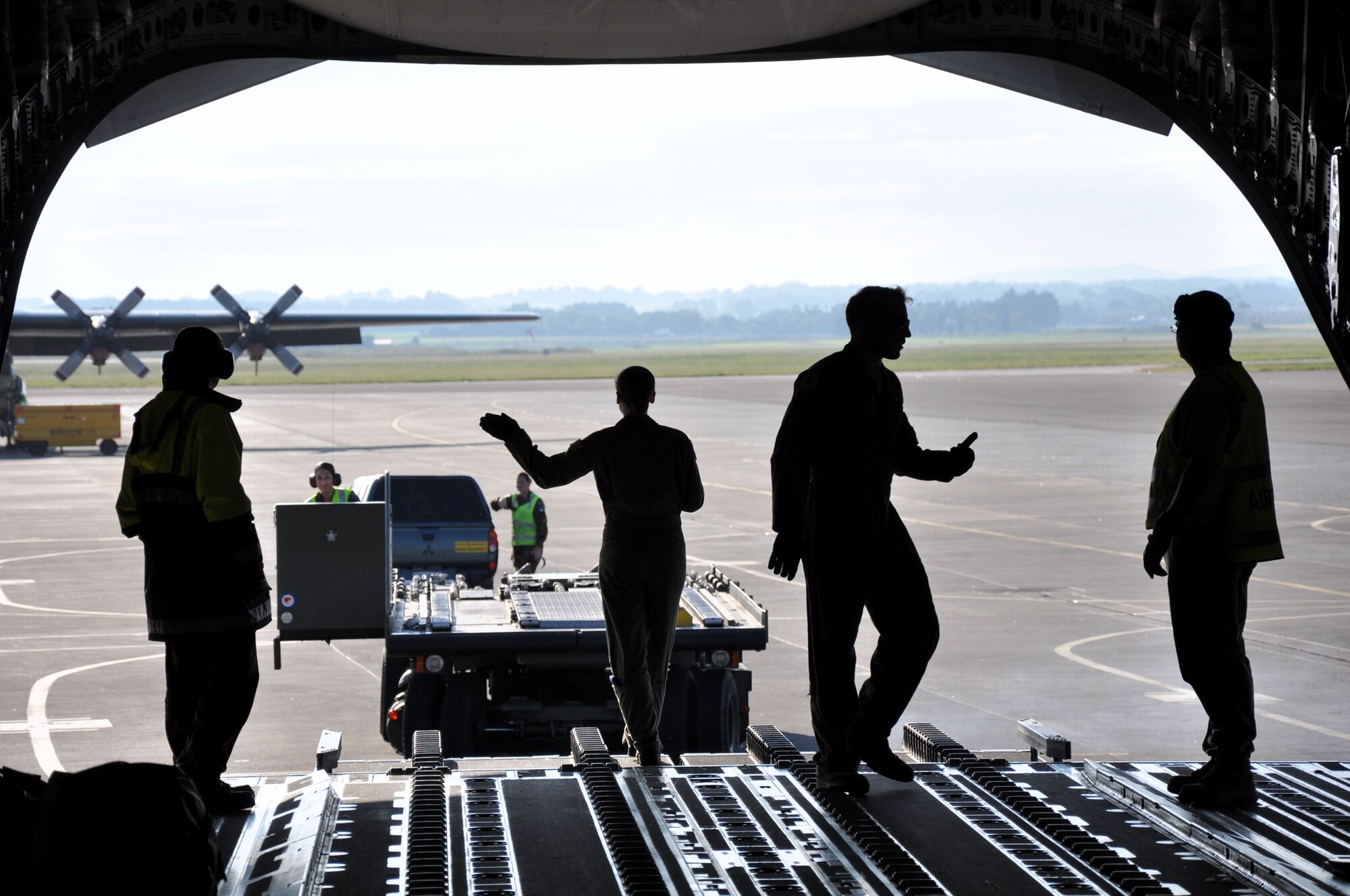 United States Air Force and Royal New Zealand Air Force airmen load a U.S. Air Force C-17 Globemaster III in preparation for an aerial delivery during Exercise Kiwi Flag at RNZAF Base Ohakea, New Zealand, Nov. 21. Kiwi Flag is a multilateral RNZAF-sponsored tactical airlift exercise conducted in New Zealand. The Royal Australian Air Force, Republic of Singapore Air Force, and the French Armed Forces of New Caledonia also participated. Kiwi Flag personnel also provided cargo and passenger airlift including tactical air drops to Exercise Southern Katipo, New Zealand Defence Force’s largest-ever multilateral joint force amphibious exercise with eight other nations participating. (U.S. Air Force Photo by Senior Master Sgt. Denise Johnson/Released)
