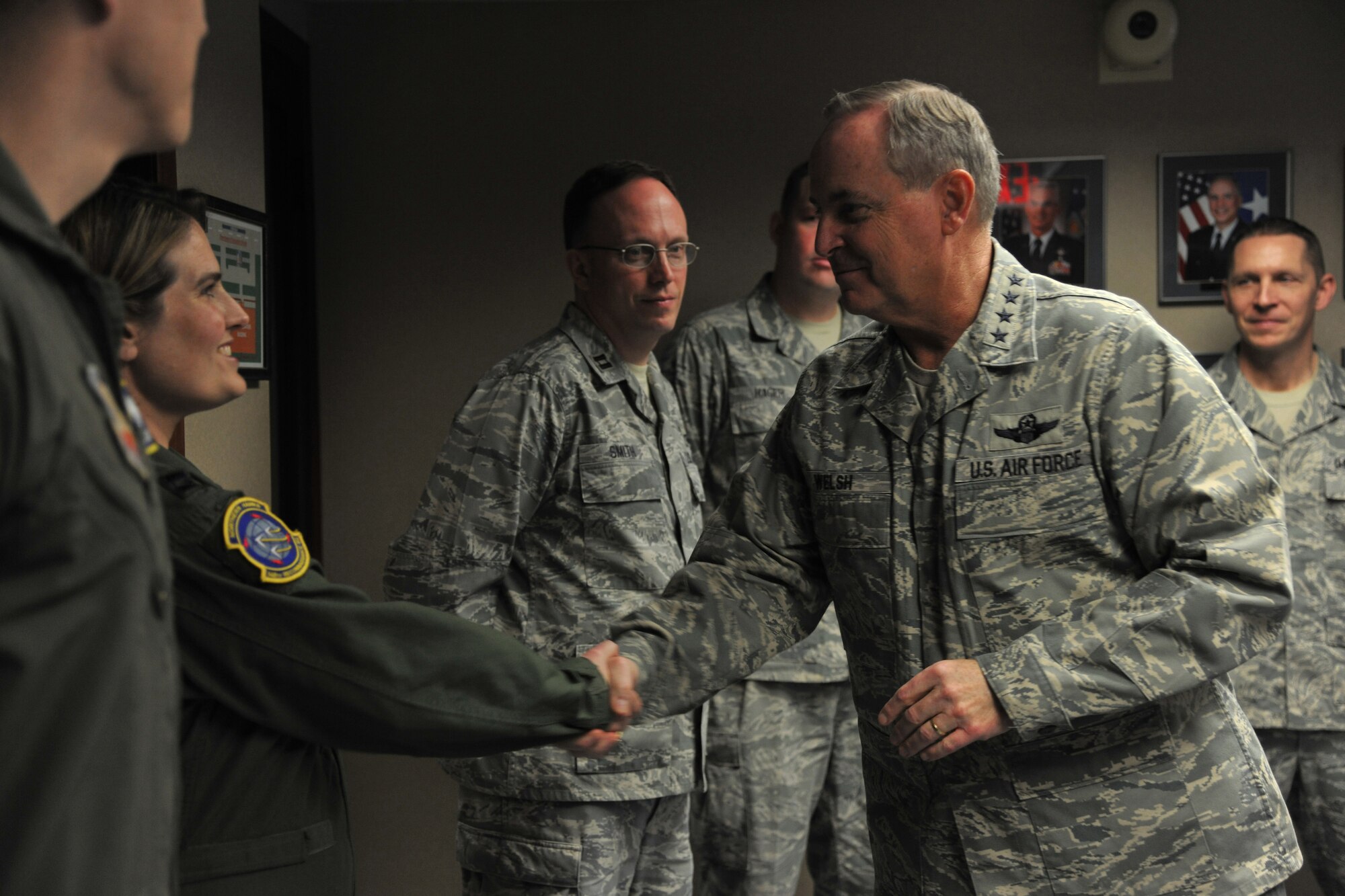 Chief of Staff of the Air Force Gen. Mark A. Welsh III greets a member of the 348th Reconnaissance Squadron on Nov. 25, 2013, at Grand Forks Air Force Base, N.D.  Welsh, his wife, Betty, and Chief Master Sgt. of the Air Force James A. Cody visited the Airmen of the base Nov. 25 and 26, 2013. (U.S. Air Force photo/Senior Airman Xavier Navarro) 