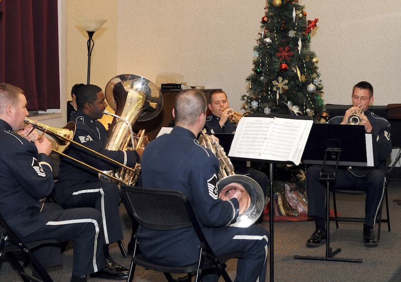 Members of the United States Air Force Band perform holiday music for the crowd during the annual Christmas tree and Menorah lighting ceremony at Joint Base Andrews, Md., Nov. 26, 2013. The ceremony brought people of different faiths together to celebrate the holidays. (U.S. Air Force photo/Airman 1st Class Ryan J. Sonnier)