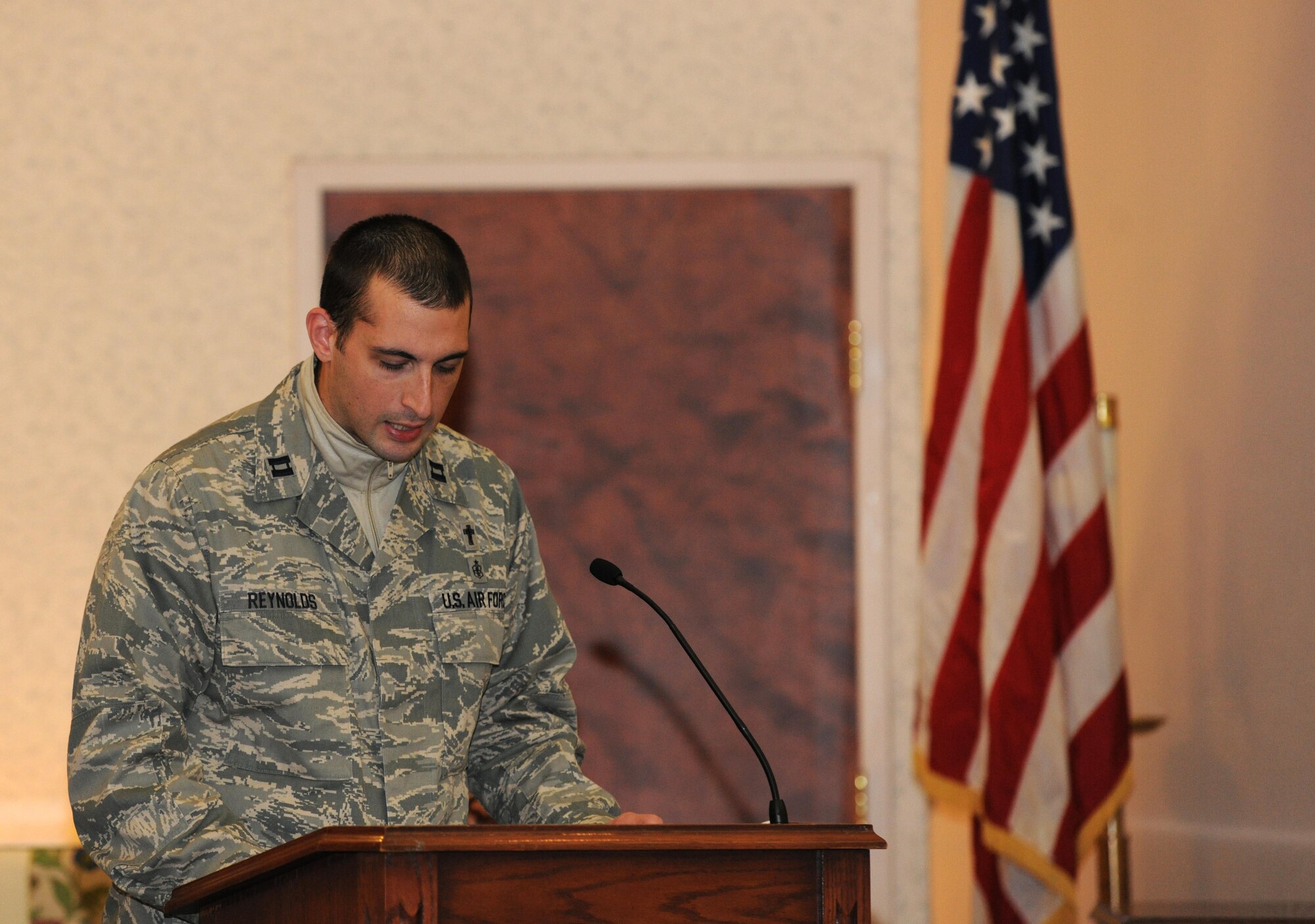 Capt. Aaron Reynolds, 11th Wing Protestant chaplain, speaks about the significance of the Christmas tree during the annual Christmas tree and Menorah lighting ceremony at Joint Base Andrews, Md., Nov. 26, 2013. The base Christmas tree as well as the Menorah was lit to recognize the beginning of the holiday season. (U.S. Air Force photo/Airman 1st Class Ryan J. Sonnier)