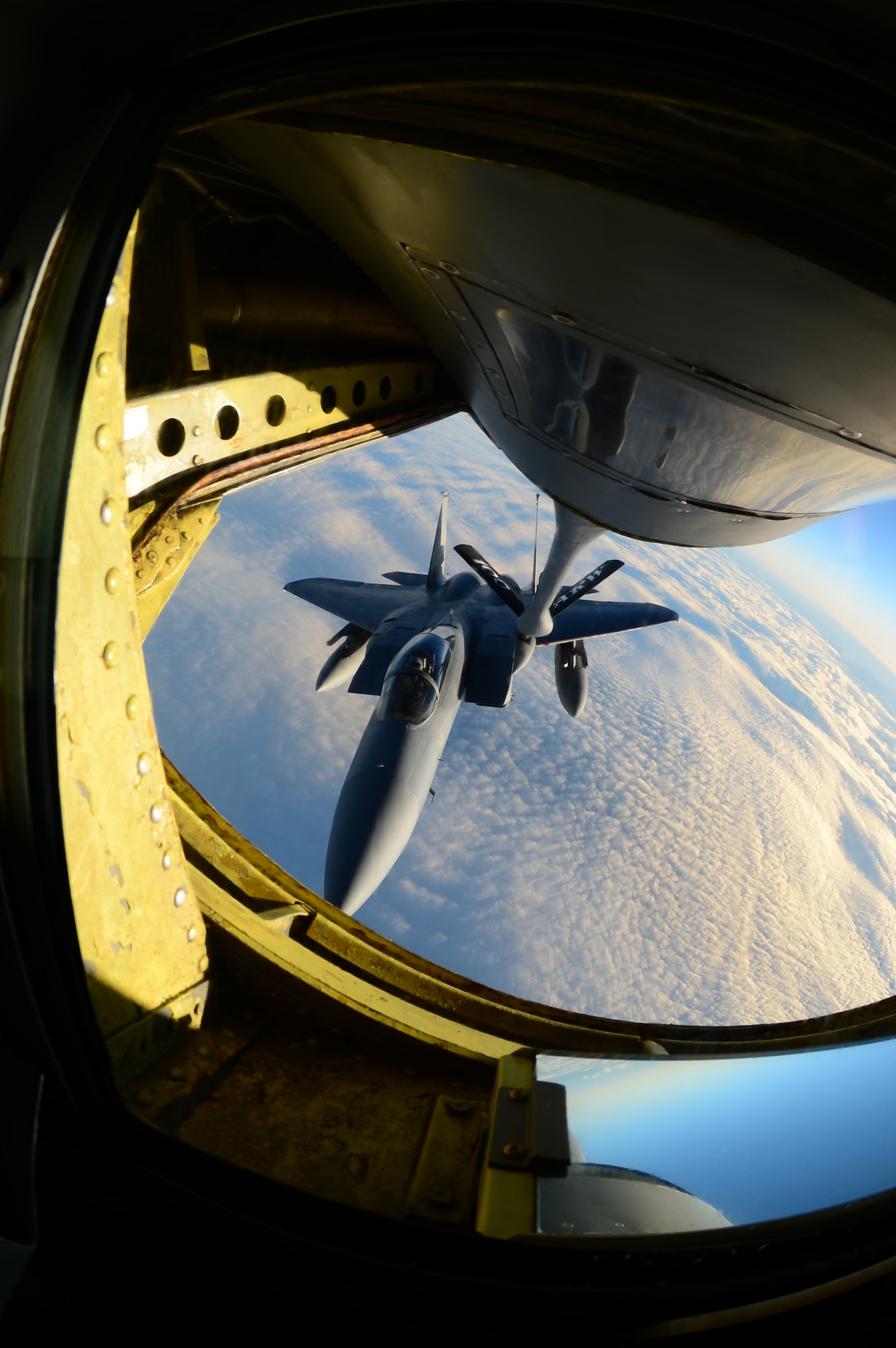 An F-15C Eagle receives fuel during an air refueling mission Nov. 19, 2013, over Iceland. The fuel was provided by a KC-135 Stratotanker from the 351st Expeditionary Air Refueling Squadron deployed from RAF Mildenhall, England. (U.S. Air Force photo by Airman 1st Class Dana J. Butler/Released)  