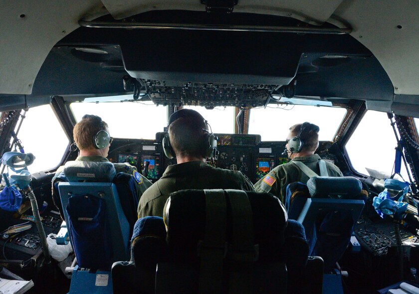 Air Force Reserve pilots from the 709th Airlift Squadron prepare for final approach to Kitakyushu Airport Nov. 24, 2013 in Japan. The airport was the crew's final stop transporting the Global Precipitation Measurement Satellite in a C-5M Super Galaxy. (U.S. Air Force photo/Tech. Sgt. Jeremy Larlee)