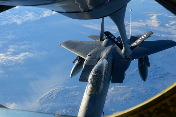 Members of a KC-135 Stratotanker crew refuel an F-15C Eagle over Iceland during a training mission Nov. 19, 2013. The 48th Air Expeditionary Group has been maintaining the North Atlantic Treaty Organization air surveillance and policing mission in Iceland since Oct. 28, 2013. (U.S. Air Force photo by Airman 1st Class Dana J. Butler/Released)  