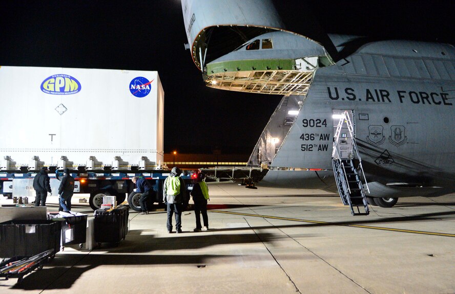 A Global Precipitation Measurement Satellite is carefully loaded into a C-5M Super Galaxy Nov. 20, 2013, at Joint Base Andrews, Md. The satellite's container was a tight fit in the aircraft only allowing about an inch of head clearance at some points. (U.S. Air Force photo/Tech. Sgt. Jeremy Larlee)