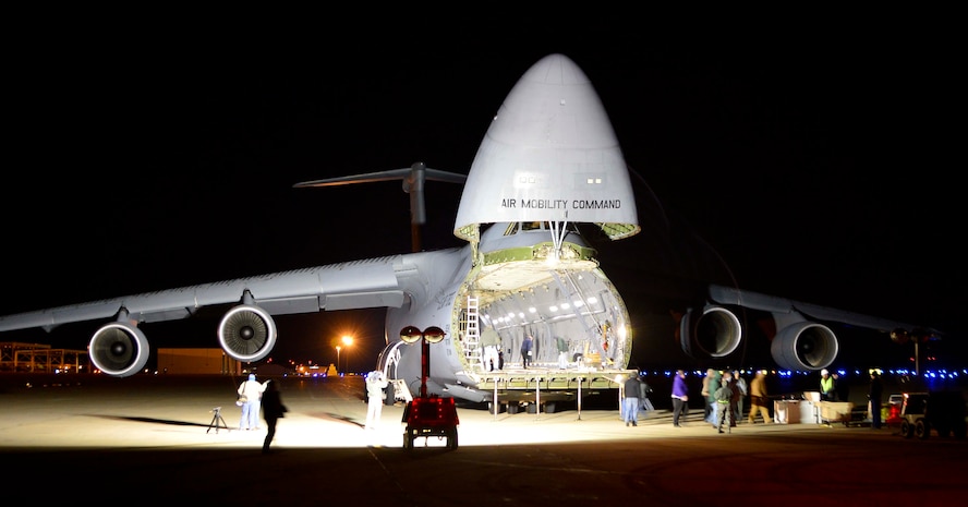 A C-5M Super Galaxy is flooded with lights prior to the load of a Global Precipitation Measurement Satellite Nov. 20, 2013, at Joint Base Andrews, Md. The satellite, its container and support equipment was loaded on the aircraft at the base en route to its final destination in Japan. (U.S. Air Force photo/Tech. Sgt. Jeremy Larlee)