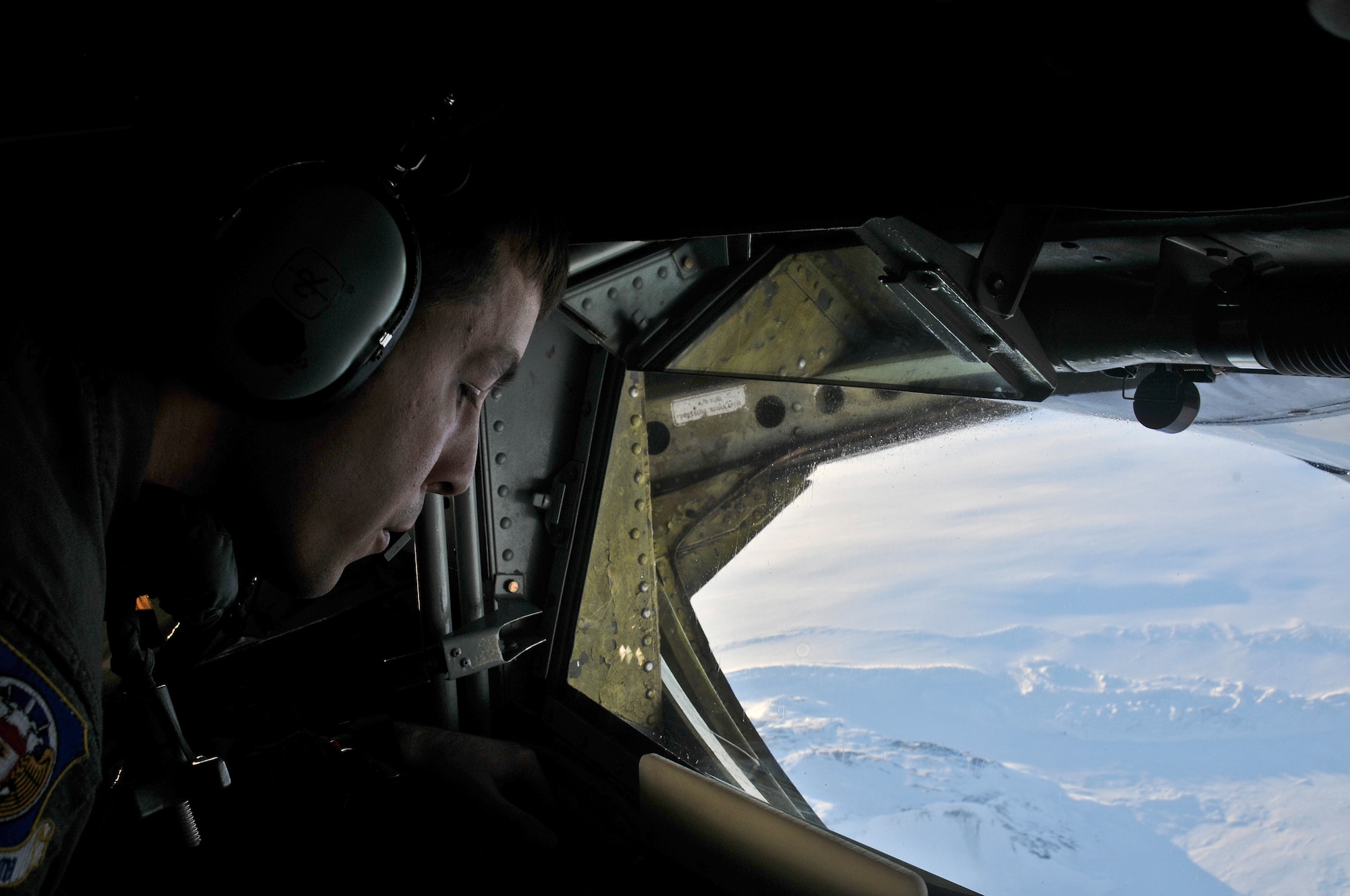 Staff Sgt. Andrew Valence, 351st Expeditionary Air Refueling Squadron boom operator, refuels an F-15C Eagle while flying over Iceland Nov. 19, 2013. The 48th Air Expeditionary Group has been maintaining the North Atlantic Treaty Organization air surveillance and policing mission in Iceland since Oct. 28, 2013. (U.S. Air Force photo by 1st Lt. Leah Davis/Released)
