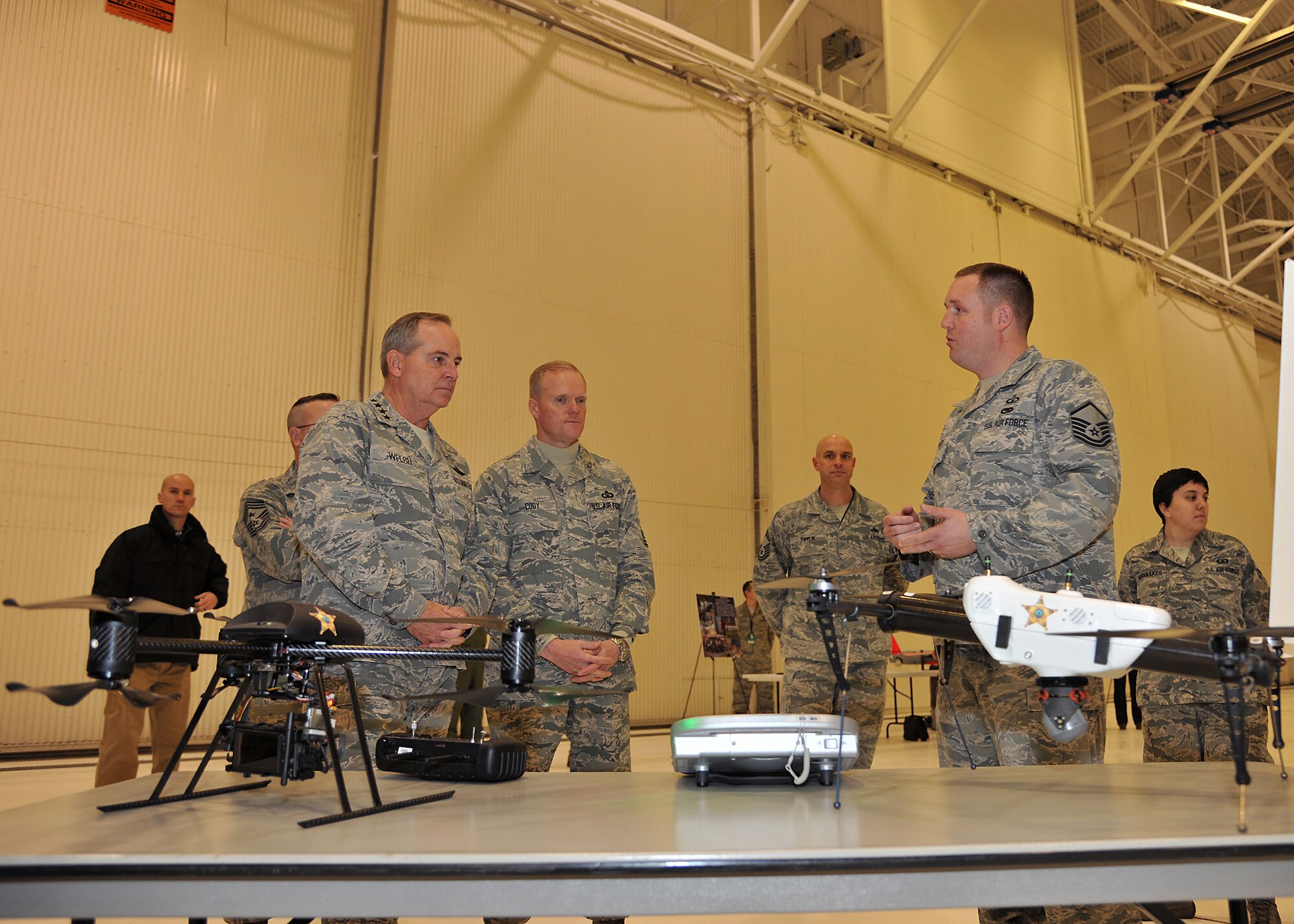 Master Sgt. Adam Hager, 319th Operations Squadron air traffic control tower chief controller, discuss the details of air traffic control equipment to Air Force Chief of Staff Gen. Mark A. Welsh III, and Chief Master Sergeant of the Air Force James A. Cody, Nov. 26, 2013 on Grand Forks, N.D. The briefing on how the 319th OSS provides for the mission was part of the second day of the senior Air Force leadership’s official visit to the base. (U.S. Air Force photo/Senior Airman Xavier Navarro)