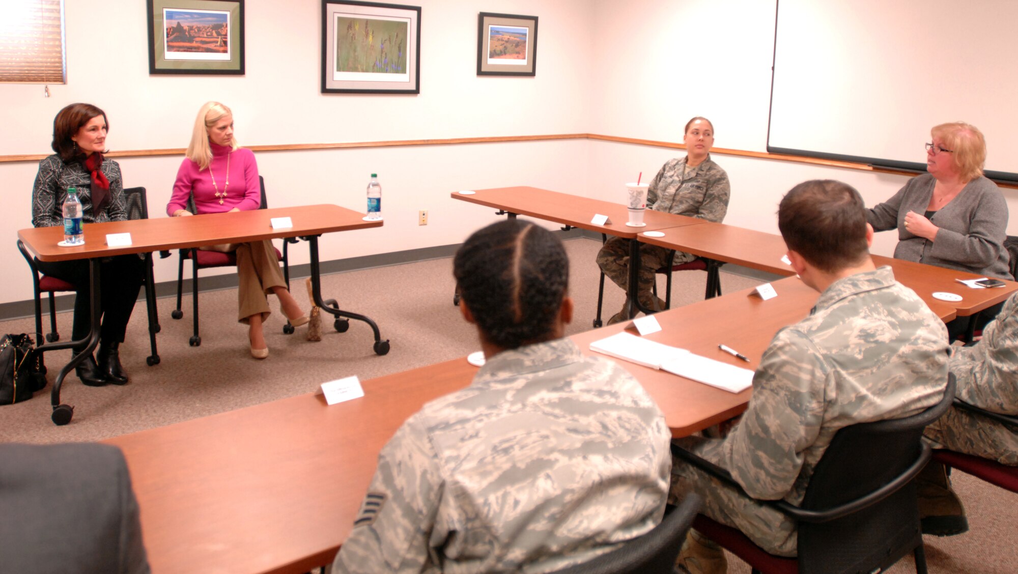 (From left) Betty Welsh, spouse of Air Force Chief of Staff Gen. Mark A. Welsh, III, and Bonnie Bauman, spouse of 319th Air Base Wing Commander Col. Paul Bauman, listen as Sue Grollimund, Sexual Assault Prevention and Response program assistant, briefs them on the SAPR program, and how several units on base come together to cultivate a culture of professionalism and respect Nov. 26, 2013, on Grand Forks Air Force Base, N.D. Mrs. Welsh focused her visit to the base on the spouse’s perspective of military service, the importance of respect and professionalism in the service, and the vital role of resiliency. As part of a two-day visit to the base, the general and Mrs. Welsh, along with Chief Master Sgt. of the Air Force James A. Cody, visited with Airmen and their families Nov. 25 and 26. (U.S. Air Force photo/Staff Sgt. Susan L. Davis)