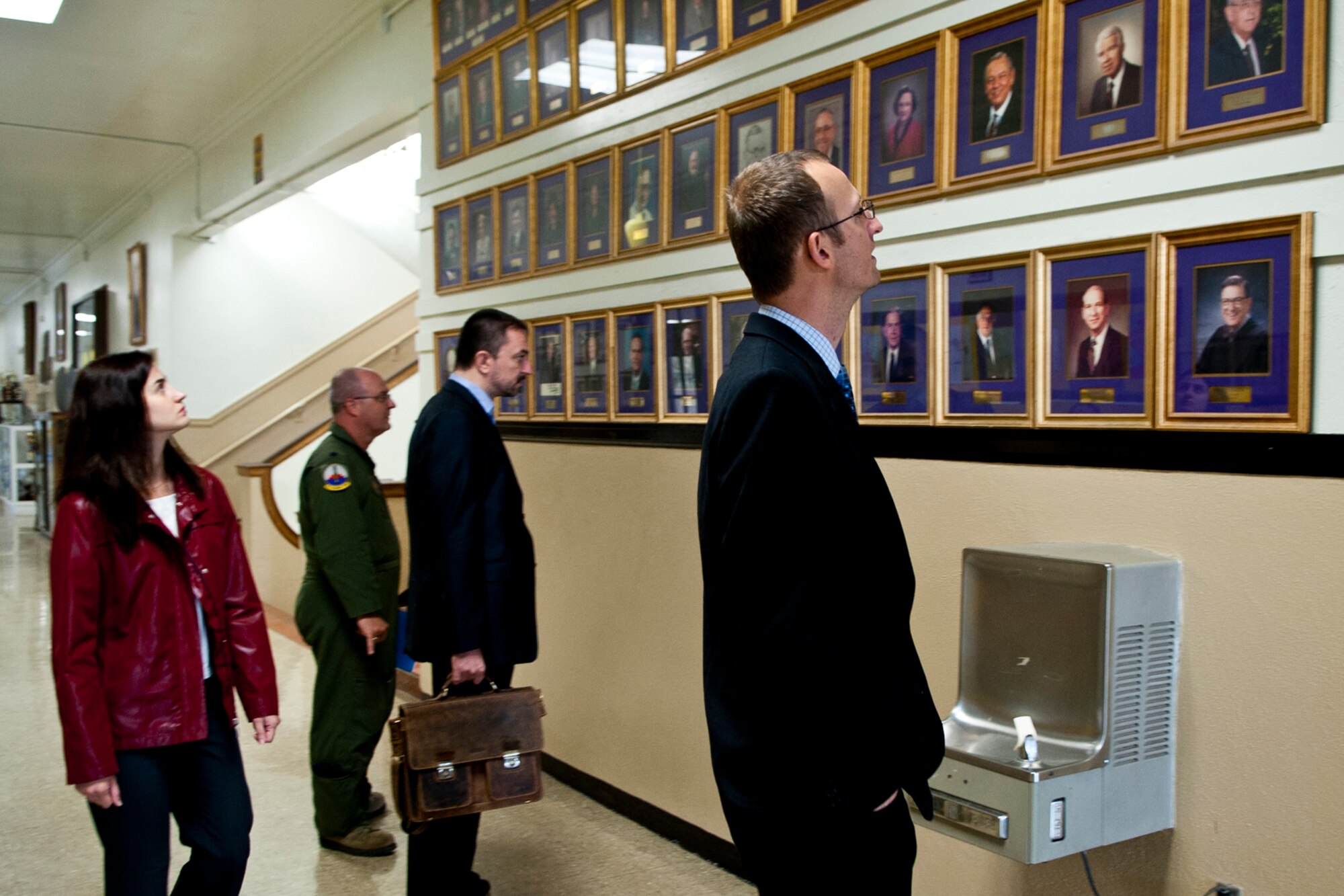 Petr Zlatohlávek, Executive Director of the NATO Information Center in Prague, (far right) views the “Hall of Fame” at Byrd High School in Shreveport, La., Nov. 8, 2013. Zlatohlávek was part of a delegation from the Czech Republic at the school to discuss the possibilities of Byrd students’ future involvement in the Aliante international competition. The international student competition is for two-member teams of 15 to 19-year-old students. Its purpose is to raise the students’ awareness (knowledge) about history, geography, politics, international affairs and above all security issues and North Atlantic Alliance. The delegation also toured the STARBASE Louisiana complex on Barksdale to learn about ways to enhance public and defense diplomacy projects that involve civil-military cooperation. The STARBASE program showcases the cooperation between the civilian and military communities to develop education projects for local children. (U.S. Air Force photo by Master Sgt. Jeff Walston)