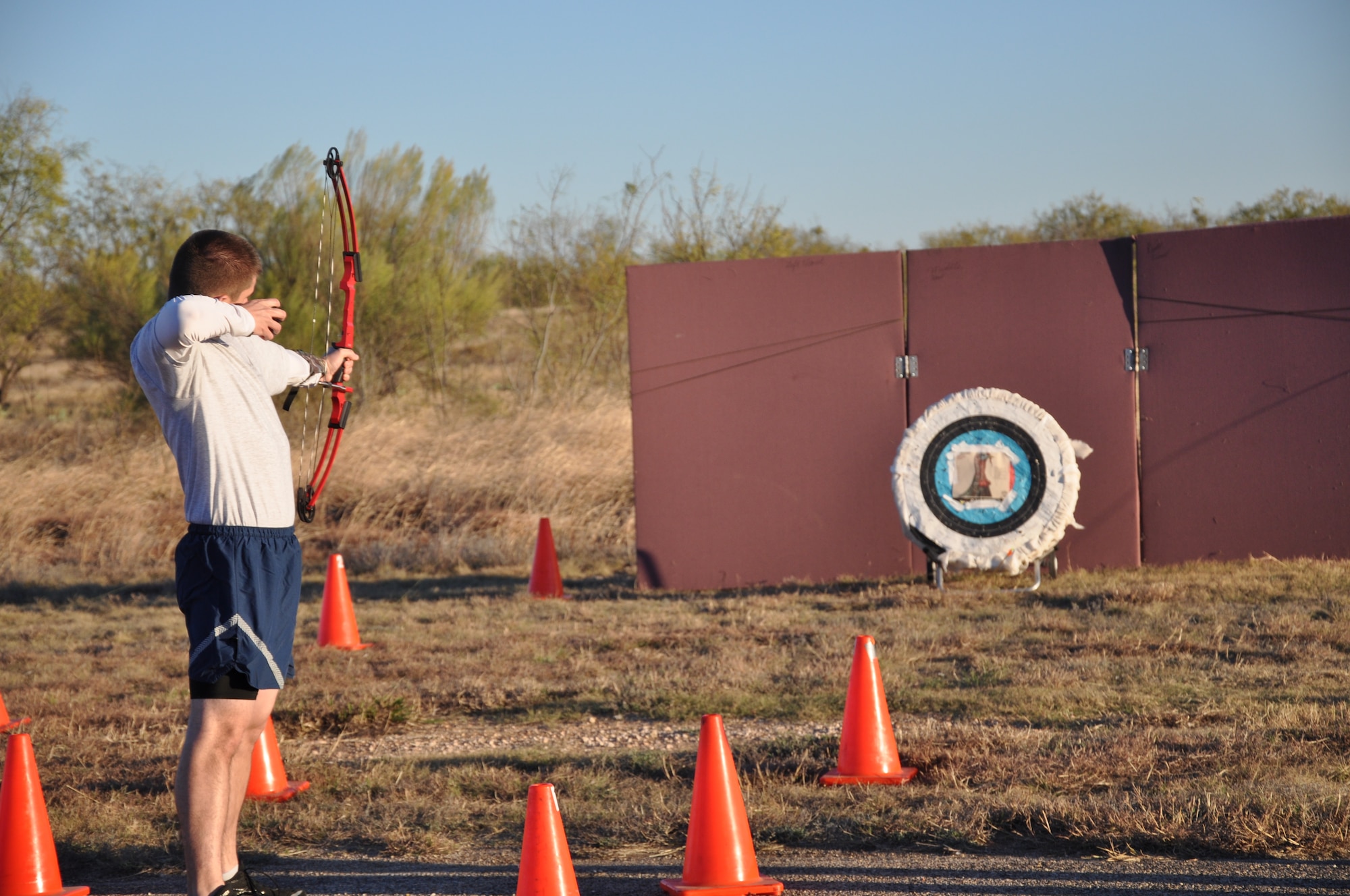 GOODFELLOW AIR FORCE BASE, Texas – Kyle Tobin, Turkey Trot participant, shoots a bow and arrow at Kickapoo Trail after the Turkey Trot Nov. 26. The top three male and female finishing runners competed for turkeys during the Turkey Shoot. (U.S. Air Force photo/ Airman 1st Class Erica Rodriguez)