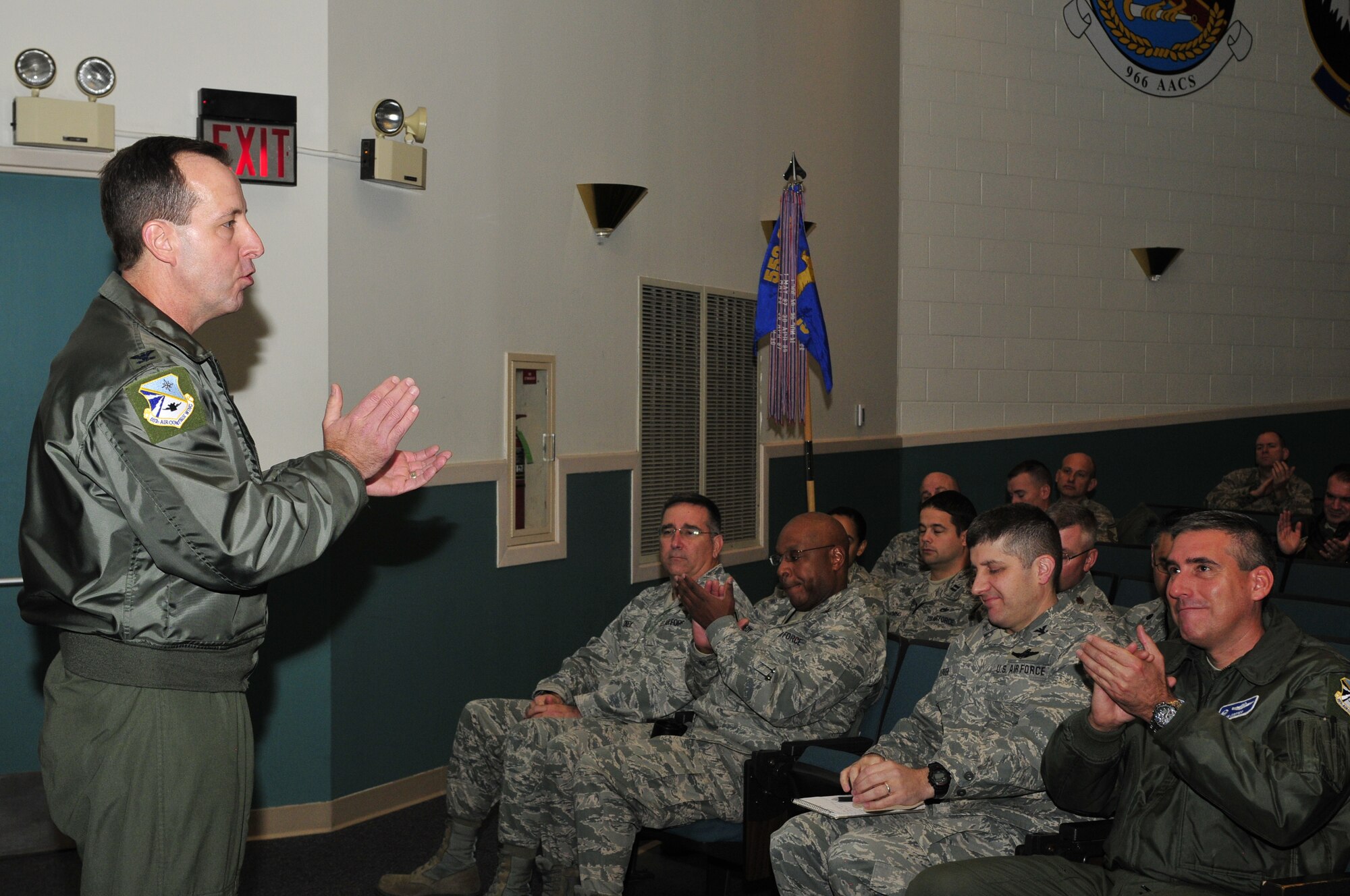 Col. Jay Bickley, 552nd Air Control Wing commander, takes the stage Saturday at the 552nd Operations Group Auditorium to congratulate members of his wing on the news they just received an overall “Excellent” rating in last week’s Combined Unit Inspection. Colonel Bickley was also proud of the fact that his wing was honored with 16 Superior Team Awards, while 76 of his Airmen were recognized as Superior Performers. (Air Force photo by Darren Heusel)