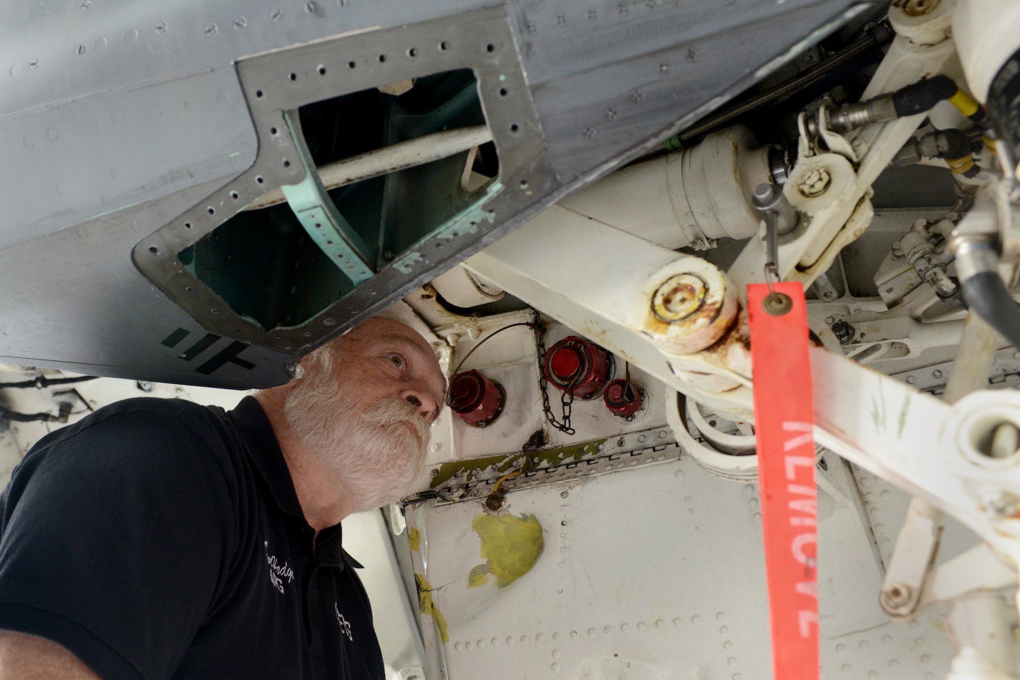 David Hodge, Air Force Engineering and Technical Services crew chief, performs a routine inspection, Nov. 15, 2013, on Mountain Home Air Force Base, Idaho. AFETS supports maintenance units in reaching self-sufficiency through training, assistance and knowledge continuity. (U.S. Air Force photo/Senior Airman Caitlin Guinazu/RELEASED)