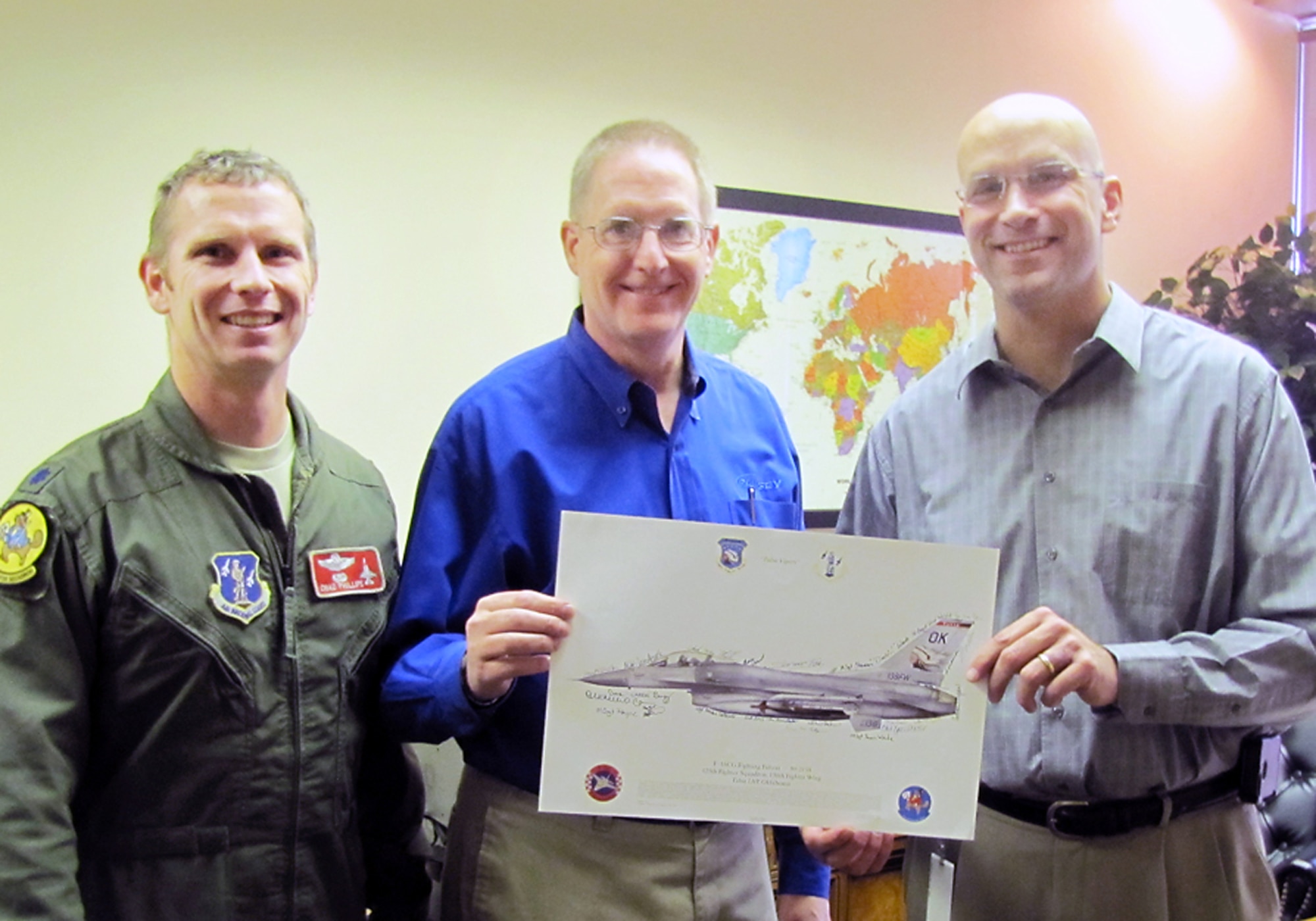 Lt Col Chad Phillips and SMSgt David Sudweeks, 138th Fighter Wing safety office,  present Mr. Rob Mutersbaugh, Vice President of Operations, Ramsey Industries, with an F-16 lithograph as a token of their appreciation for the employer support shown by Ramsey Industries during a short notice deployment by SMSgt Sudweeks.  (U.S. Air Force photo by Senior Master Sgt. Bryan Hilbert/Released)