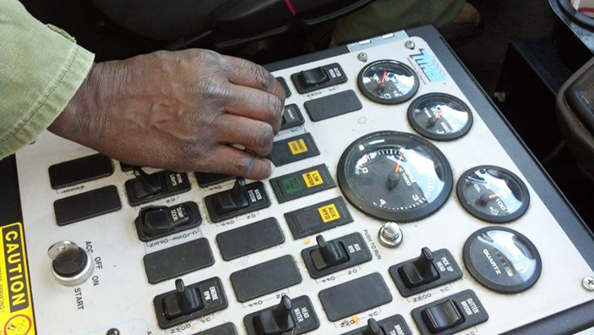 A control panel inside a Tymco street sweeper truck can control any function, including the lowering of gutter brooms to sweep up debris, and vacuum to penetrate and lift trash from pavement across Robins. (U.S. Air Force photo by Jenny Gordon)