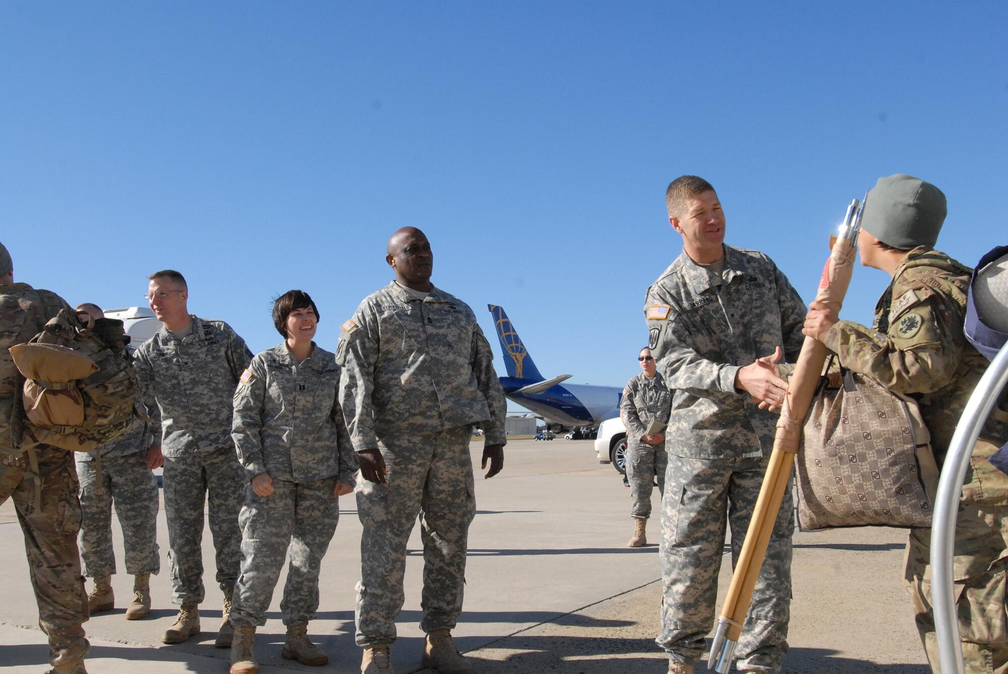 Brig. Gen. Joe Jarrard, Georgia National Guard assistant adjutant general, greets Soldiers from the 201st Regional Support Group Nov. 18, 2013, at Joint Base McGuire-Dix-Lakehurst as they return from a 10-month deployment at Helmand province, Afghanistan. The 72nd Field Artillery Brigade, part of First Army Division East, will demobilize The National Guard Soldiers, ensuring any challenges or issues are resolved before the Soldiers are reunited with their families. (U.S. Army photo by Capt. Kelvin Scott/Released)