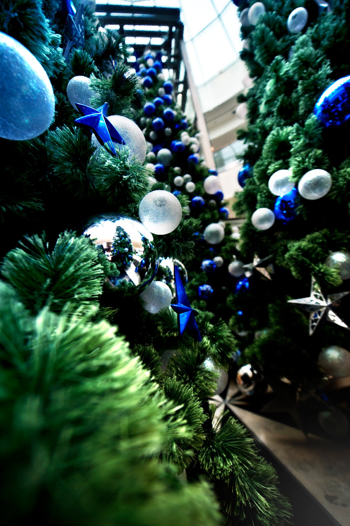 Angel Trees have sprouted up around the KMC, providing holiday cheer and financial support for families in need at Ramstein Air Base, Germany. Last year the Angel Tree program helped nearly 250 families and 400 children during the holiday season. Donation drop boxes and tree locations  are at the following public areas on Ramstein: KMCC, Express Shoppette, E'Club, O'Club, Commissary, North and Southside Chapels and the post office as well as the following locations on Vogelweh: Commissary, Chapel, Express Shoppette. (U.S. Air Force illustration/Airman 1st Class Jordan Castelan)