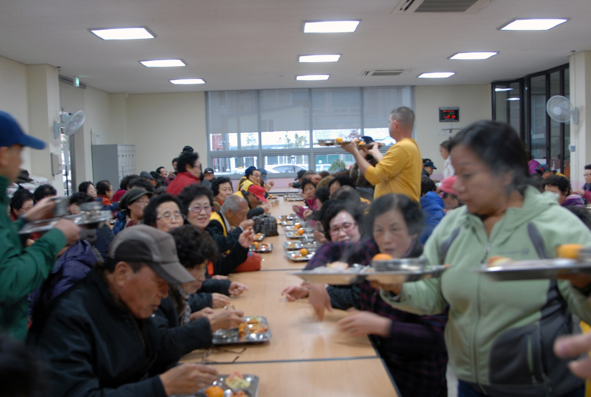 Senior Master Sgt. Eva Rodgers, Superintendent Wing Staff Agency, serves lunch at the Gunsan City Red Cross to elderly citizens, Nov. 27, 2013. The Wolf Pack focused on the well-being of others by helping out in the local community as a part of becoming resilient. (U.S. Air Force photo by Master Sgt. Sabrina Johnson/Released)