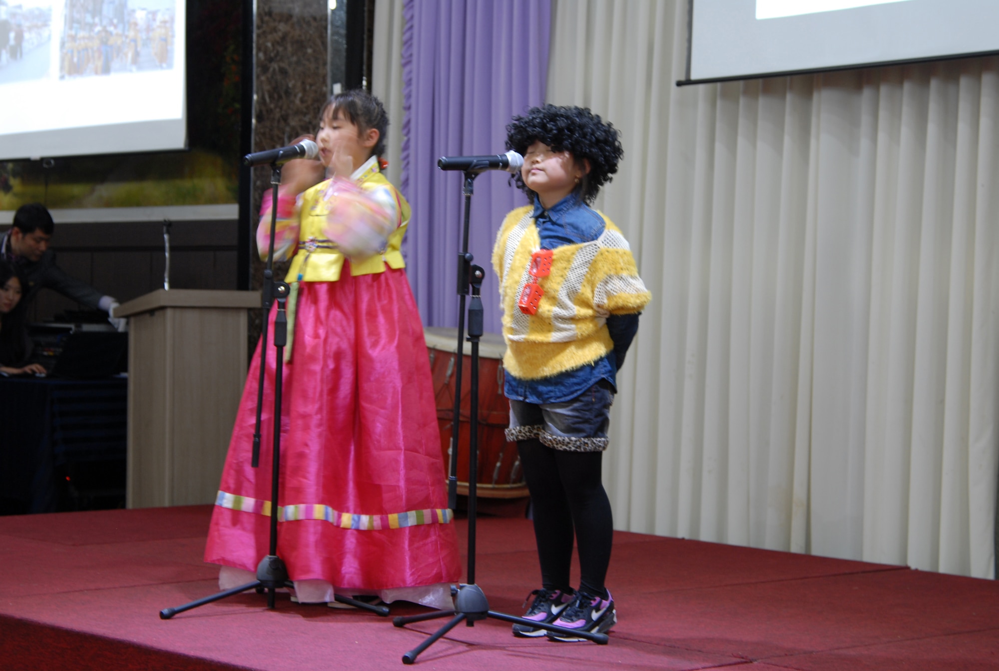 Gunsan City elementary school students speak English during an appreciation dinner for 8th Fighter Wing volunteers, Nov. 26, 2013. More than 140 Wolf Pack members volunteered 3800 hours this past year to help Korean students improve their English. (U.S. Air Force photo by Master Sgt. Sabrina Johnson/Released)