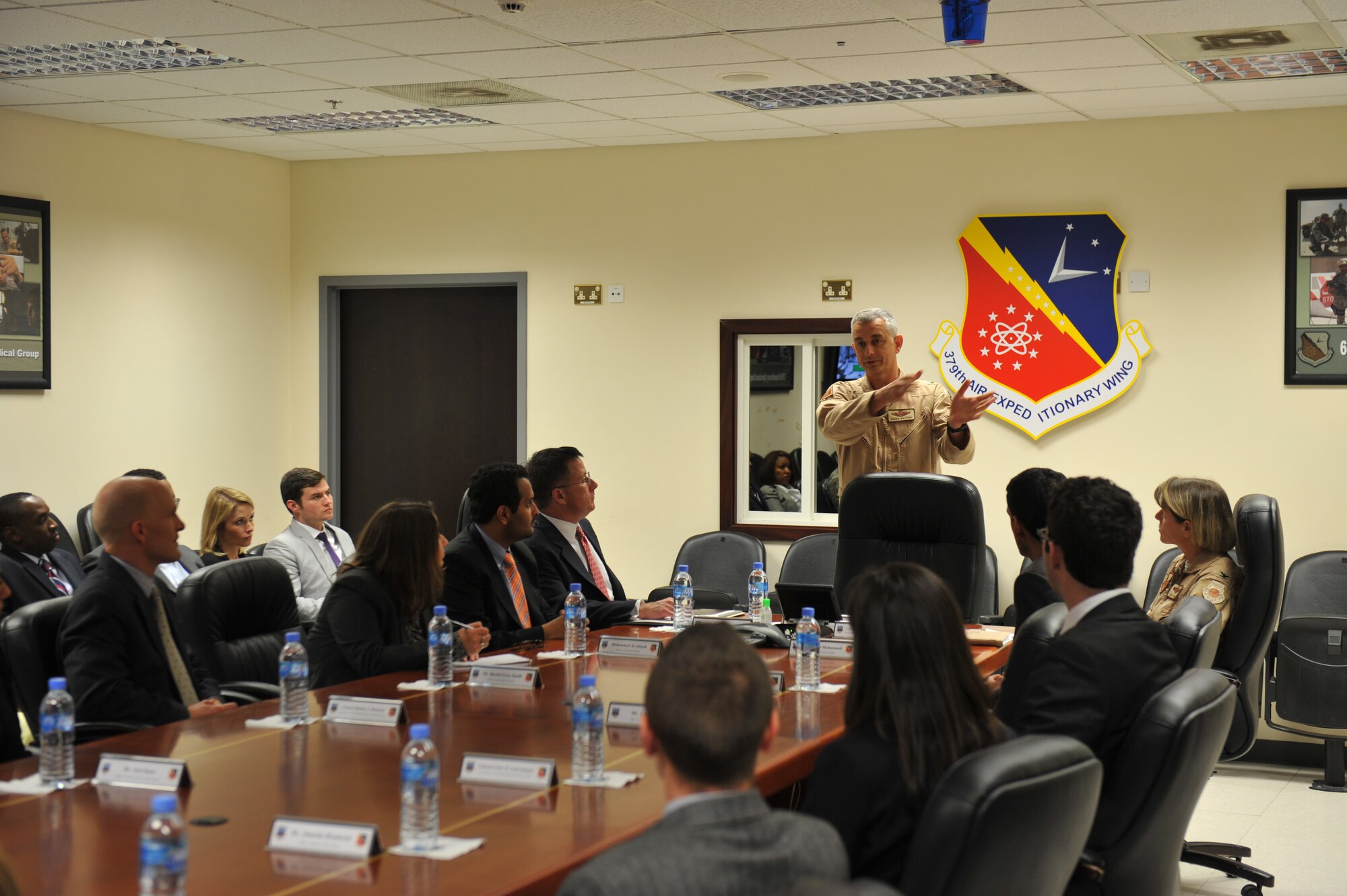 Brig. Gen Roger Watkins, 379th Air Expeditionary Wing commander, provides opening remarks to congressional delegates prior to a mission brief at the 379th AEW in Southwest Asia Nov. 25, 2013. Congressional delegates received an overview of the 379th AEW missionand learned about the host nation in terms of economic, cultural and strategic position. (U.S. Air Force photo/ Master Sgt. David Miller)