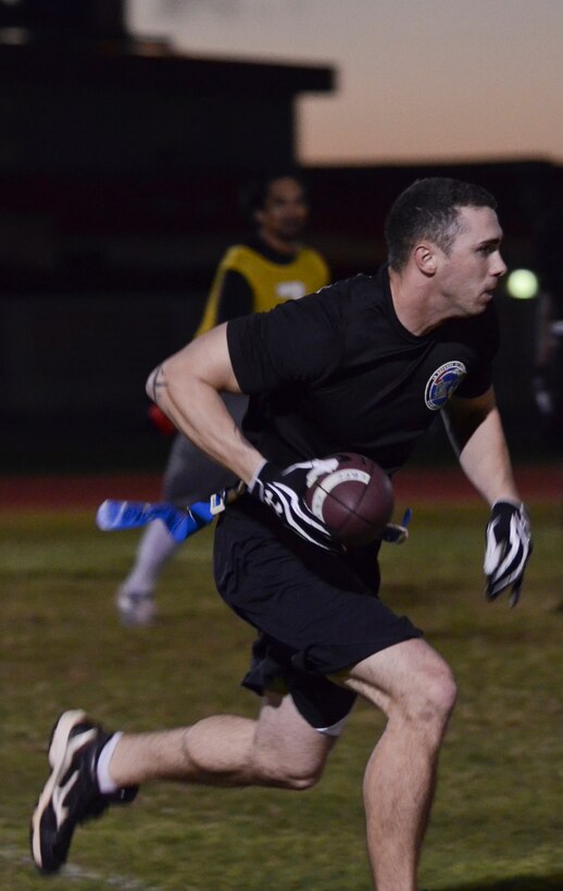Christopher Durham, 94th Army Air and Missile Defense Command, runs down the field during an intramural flag football game Nov. 25, 2013, on Andersen Air Force Base, Guam. The 94th AAMDC defeated 22nd Space Operations Squadron Detachment 5, 40-0. (U.S. Air Force photo by Senior Airman Marianique Santos/Released)