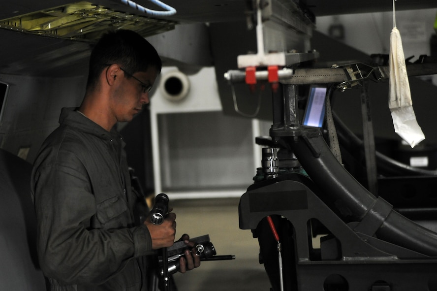 Staff Sgt. Brent Cratty, 35th Maintenance Squadron Aircraft Fuel Systems technician, prepares to remove an F-16 Fighting Falcon wing Nov. 18, 2013 at Misawa Air Base, Japan. Cratty was the lead of a two-man crew that executed the wing change. (U.S. Air Force photo by Senior Airman Derek VanHorn)
