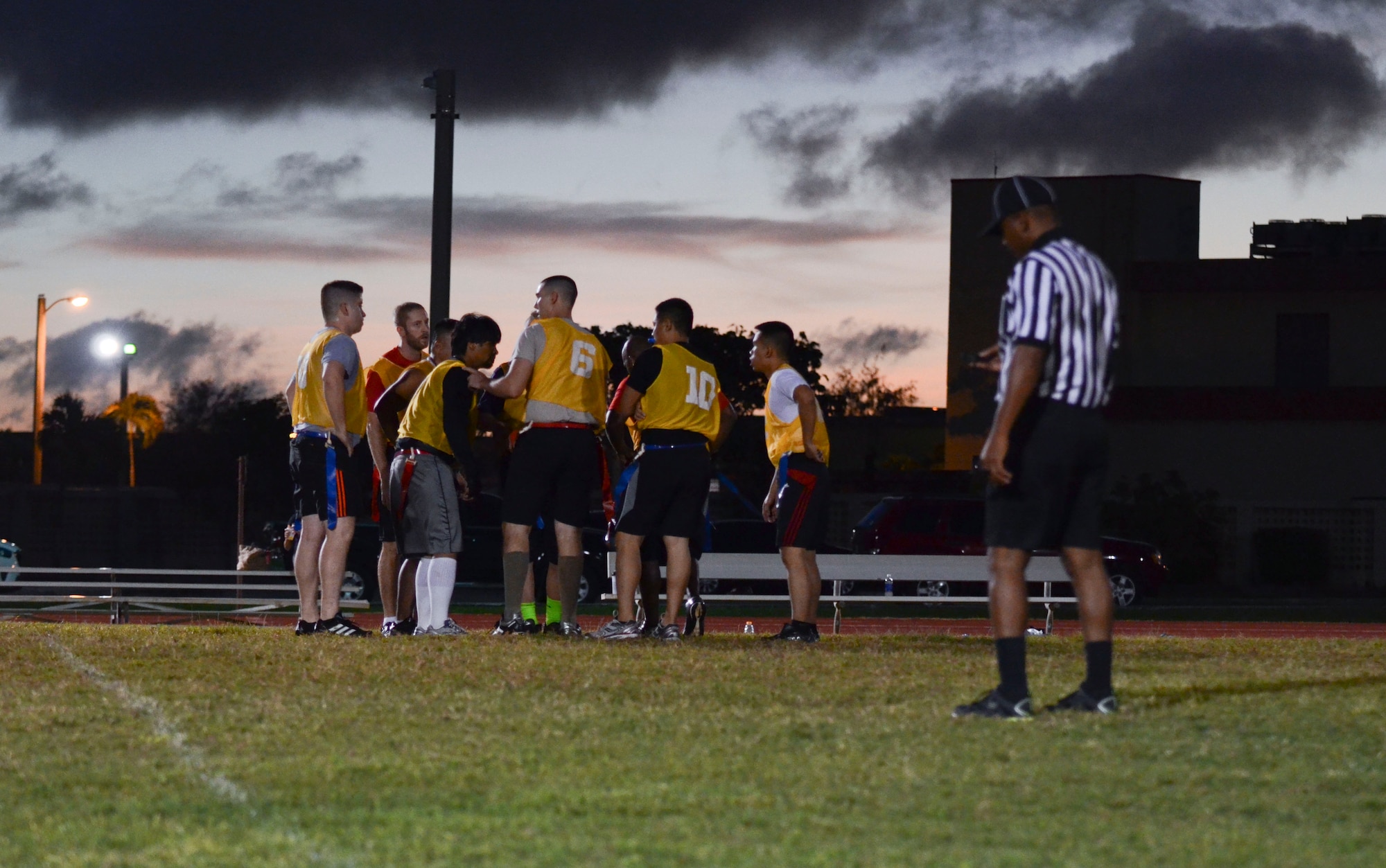 Players from the 22nd Space Operations Squadron Detachment 5 huddle during a timeout Nov. 25, 2013, at an intramural flag football game on Andersen Air Force Base, Guam. The 94th Army Air and Missile Defense Comman defeated 22nd SOPS Det 5, 40-0. (U.S. Air Force photo by Senior Airman Marianique Santos/Released)